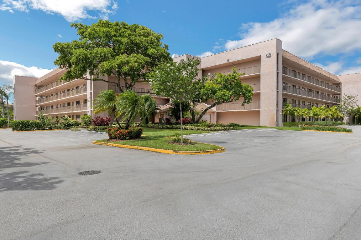 Stunning Penthouse Corner Unit in Sunrise Lakes Welcome to this beautifully maintained 2-bedroom, 2-bathroom penthouse in the desirable 55+ community of Sunrise Lakes. This bright and spacious corner unit offers a thoughtful split-bedroom layout, a dedicated laundry room with washer and dryer, and an oversized primary suite with generous closets and a large en-suite bath. Enjoy the ease of gated living with access to a clubhouse, community pool, and assigned parking — all nestled in a quiet, well-kept neighborhood.