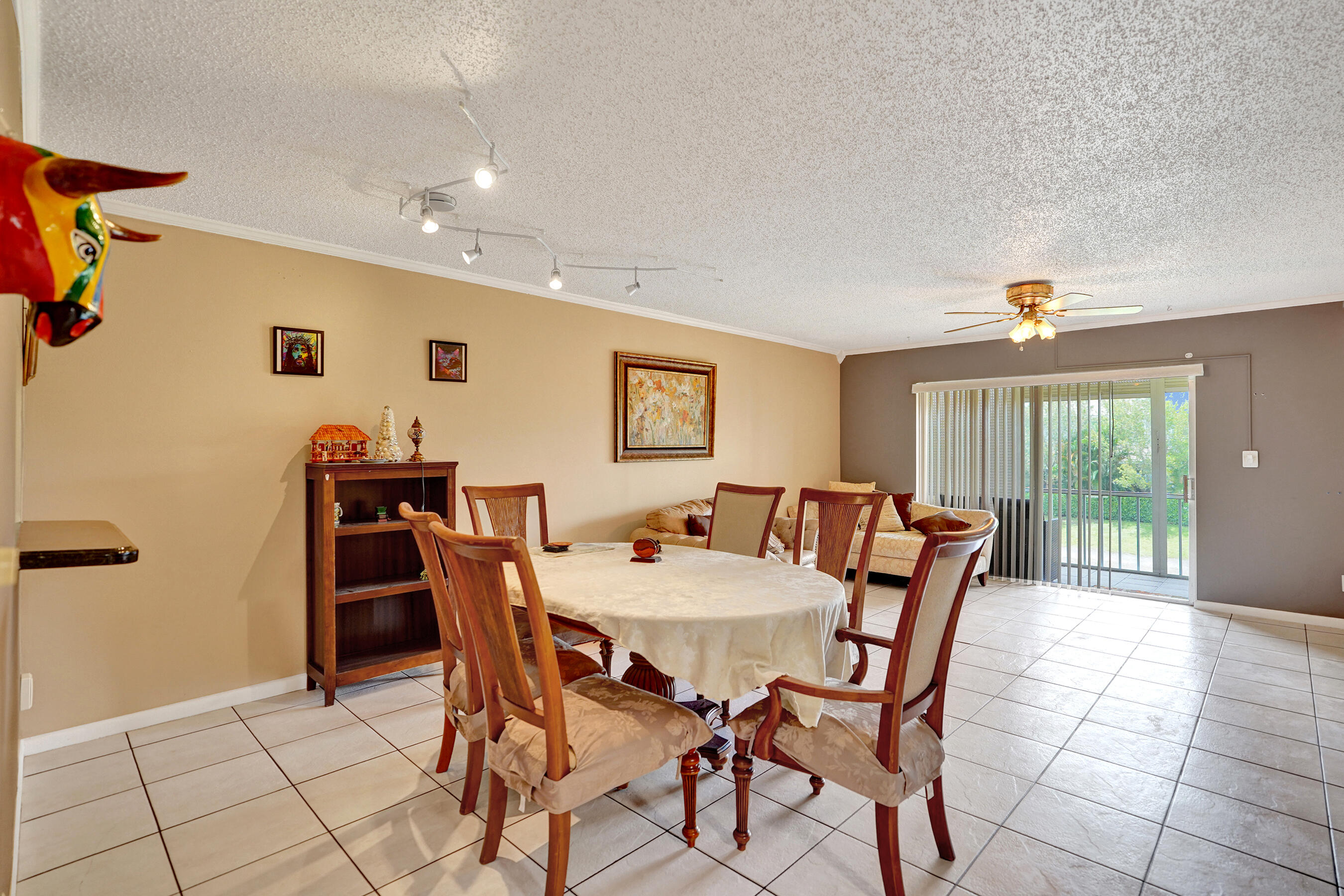 Priced to sell 2 bedroom, 2 bathroom condo in the heart of Coral Springs! Located on the second floor, this unit offers a practical layout with tile floors throughout, an updated kitchen with granite countertops, plenty of cabinet space, and a convenient in unit washer and dryer. Both bathrooms have been updated, and the primary bedroom features a custom walk in closet with great storage. Enjoy a screened balcony with garden views and access to the community pool. No special assessments, making this an even better opportunity for buyers looking for value in today's market. Conveniently located near shopping, dining, parks, schools, and major roads. A great option for an owner occupant looking for location, convenience, and affordability in Coral Springs.