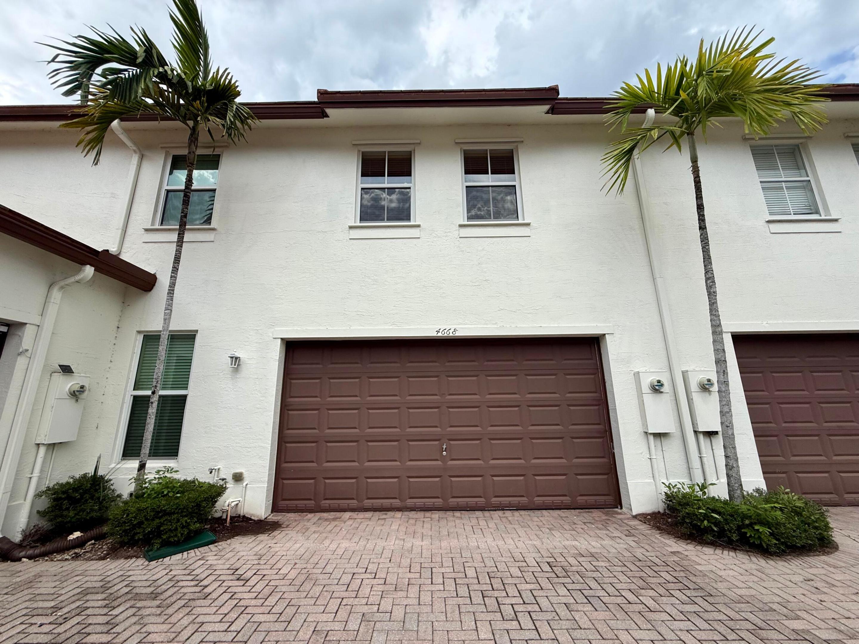 BEAUTIFUL AND WELL MAINTAINED 3/2.5 TOWNHOUSE. DOUBLE CAR GARAGE. HIGH CEILINGS. 1ST FLOOR OFFERS AN OPEN AND INVITING LAYOUT. SPACIOUS LIVING AND DINING AREAS PERFECT FOR ENTERTAINING. KITCHEN WITH STAINLESS STEEL APPLIANCES. GRANITE COUNTERTOPS. AMPLE CABINET SPACE. PANTRY AND ADDITIONAL STORAGE CLOSETS. CONVENIENT HALF BATH. DIRECT ACCESS TO DOUBLE GARAGE. PRIVATE FRONT ENTRY WITH DECORATIVE GATE. 2ND FLOOR FEATURES A SPACIOUS PRIMARY SUITE WITH PRIVATE BALCONY. TWO LARGE WALK-IN CLOSETS. PRIMARY BATHROOM WITH SOAKING TUB. SEPARATE SHOWER. DUAL VANITY. AND PRIVATE TOILET ROOM. FULL 2ND BATHROOM. LAUNDRY ROOM WITH FULL SIZE WASHER AND DRYER. GATED COMMUNITY OFFERING RESORT STYLE POOL WITH LAKE VIEWS. BASIC INTERNET AND CABLE INCLUDED. WALKING DISTANCE TO THE PROMENADE AND MONARCH HIGH. PERFECT LOCATION FOR THIS TOWNHOUSE. STEPS FROM THE POOL AND AMENITIES. COMMUNITY LOCATED DIRECTLY IN FRONT OF THE PROMENADE. WALKING DISTANCE TO MONARCH HIGH SCHOOL. CLOSE TO MAJOR HIGHWAYS FOR EASY COMMUTE.  MOVE-IN READY CONDITION. BRIGHT, CLEAN, AND WELL MAINTAINED. EASY TO SHOW. MUST SEE.