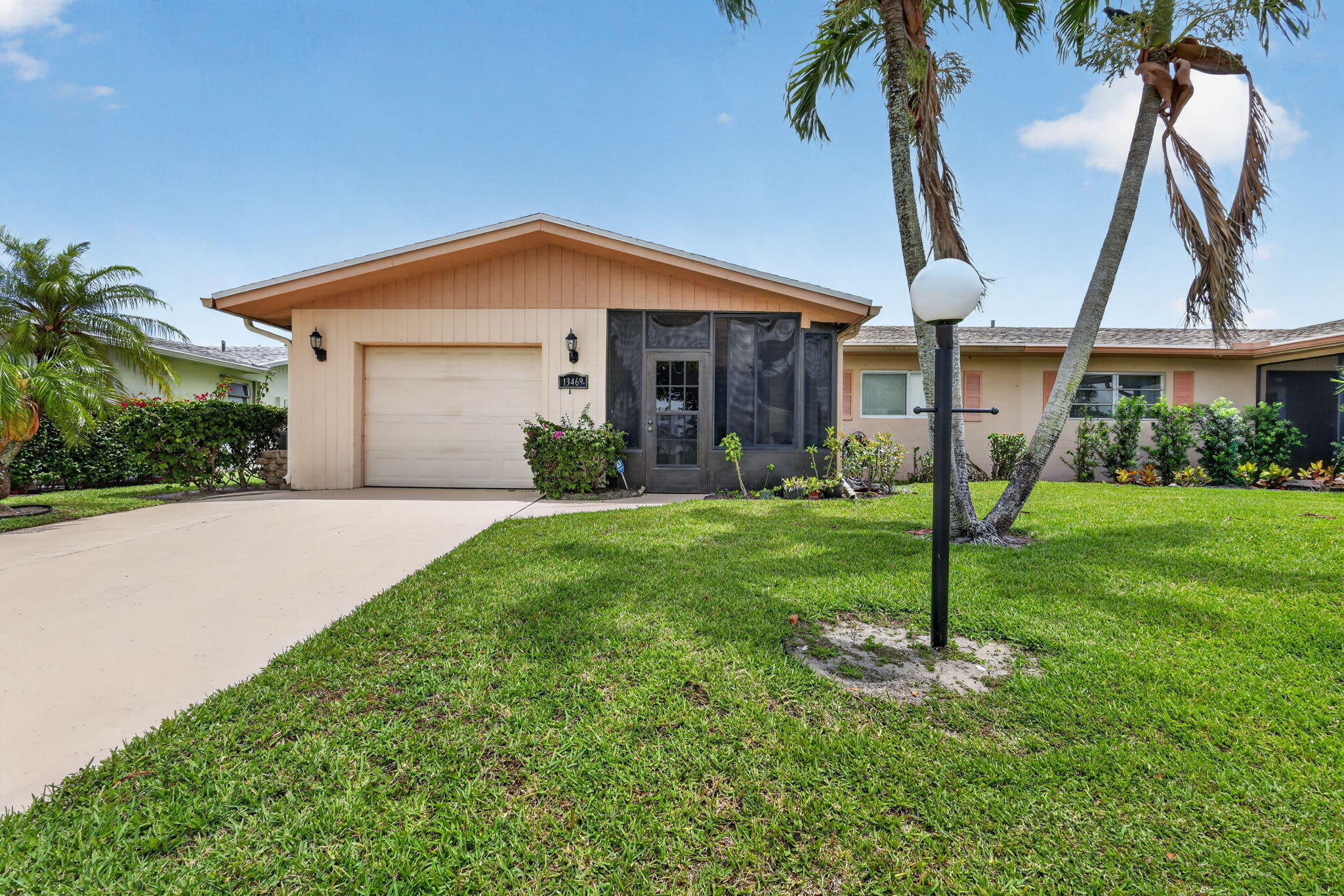 Lovely 3 bedroom, 2 bath Villa with attached garage and driveway for additional cars. Updated kitchen, glass enclosed porch, and outdoor patio with views of the canal. This property is beautifully landscaped. Active Clubhouse with pool, fitness room, tennis, and library. Located near shopping, restaurants, and a short drive to the beach!