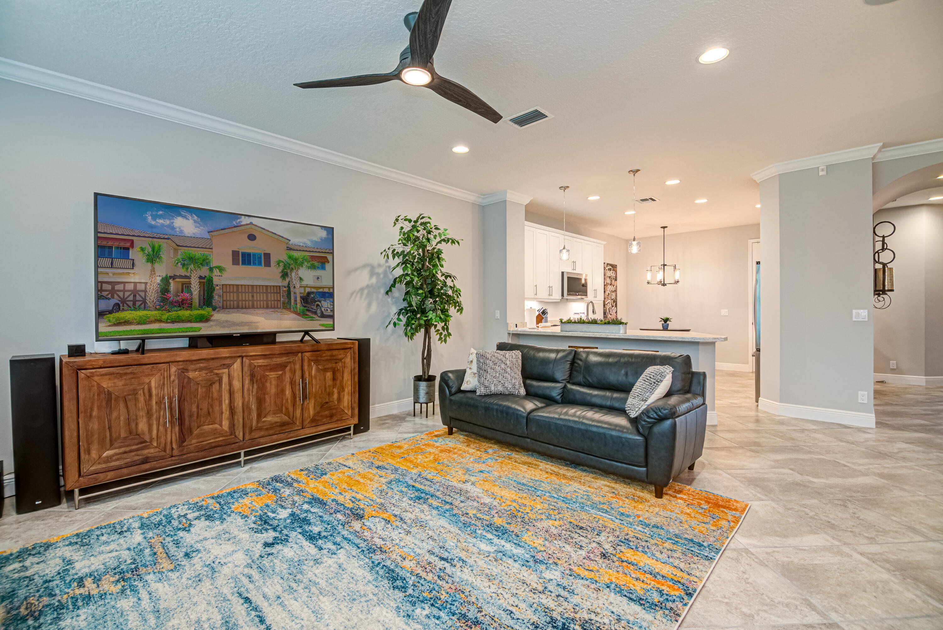 Welcome to this beautifully appointed 3-bedroom, 2.5-bathroom townhome offering nearly 3,000 square feet of sophisticated living space, nestled within one of Wellington's premier gated communities. Whether you're seeking a full-time residence or a seasonal retreat, this home delivers the perfect blend of elegance, comfort, and convenience. Step inside to an open-concept layout thoughtfully designed for modern living, featuring high-end finishes and custom decor throughout. Enjoy plantation shutters, a double oven, high-efficiency front-loading washer and dryer, and a spacious 2-car garage with epoxy flooring. The home overlooks a quiet golf course, offering serene views and a tranquil setting right from your backyard. Whether you're relaxing indoors or enjoying a peaceful morning on the patio, every detail has been designed for refined living. As part of this exclusive community, residents enjoy access to resort-style amenities, including a clubhouse, fitness center, and sparkling pool perfect for unwinding or entertaining. Located just 15 minutes from WEF and White Fences, this home is ideal for equestrian enthusiasts or those who value Wellington's vibrant lifestyle. Don't miss the rare opportunity to own this stunning townhome that combines style, space, and a prime location.