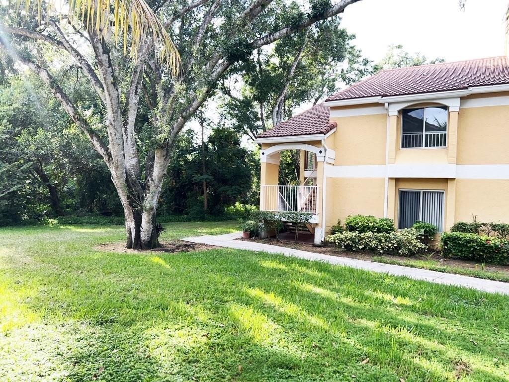 Welcome to this beautifully updated 2-bedroom, 2-bathroom end-unit condominium located in the desirable Sailboat Pointe community in Oakland Park. Offering 1,241 square feet of well-designed living space, this bright and spacious residence enjoys a peaceful setting overlooking beautiful trees, providing added privacy and tranquil views.  The interior has been freshly painted and features wood-look vinyl flooring throughout the living areas and both bedrooms. The kitchen is equipped with stainless steel appliances, while both bathrooms have been tastefully renovated with modern finishes. The thoughtfully designed split-bedroom floor plan and two full bathrooms offer comfort and convenience for residents and guests alike.  Ideally situated just a short walk from the community fitness center and pool, this home also offers easy access to I-95, making commuting and travel a breeze. Enjoy comfortable, low-maintenance living in a well-maintained community close to shopping, dining, parks, and beaches.