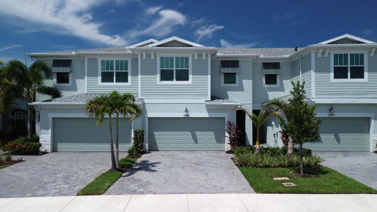 WIFI AND UTILITIES INCLUDED! BUILT IN 2025, this luxury townhome located in the GATED COMMUNITY of Avila is just MINUTES away from Stuart and Jensen Beaches and Historic Downtown Stuart. Located directly across from the Treasure Coast Mall, dining, national retailers, Cleveland Clinic, movie theaters and Martin County Schools, this beautiful townhome is MOVE-IN Ready! The home features 18X18 TILE flooring throughout the entire first floor, White 42" Cabinets in the kitchen, w/ a large, designer granite countertop ISLAND for entertaining guests, upgraded DUAL VANITIES in the master bathroom, w/ a WALK-IN closet, washer and dryer hook up, UPGRADED STAINLESS STEEL whirlpool appliances, and LED lighting throughout the home! The home features 3 spacious BEDROOMS and 2 BATHROOMS upstairs with a  half bath downstairs. The dual car GARAGE and paved driveway accommodate up to 6 compact cars, w/ room for STORAGE! Relax in the COMMUNITY POOL or enjoy the paved, rear SCREENED IN PATIO.