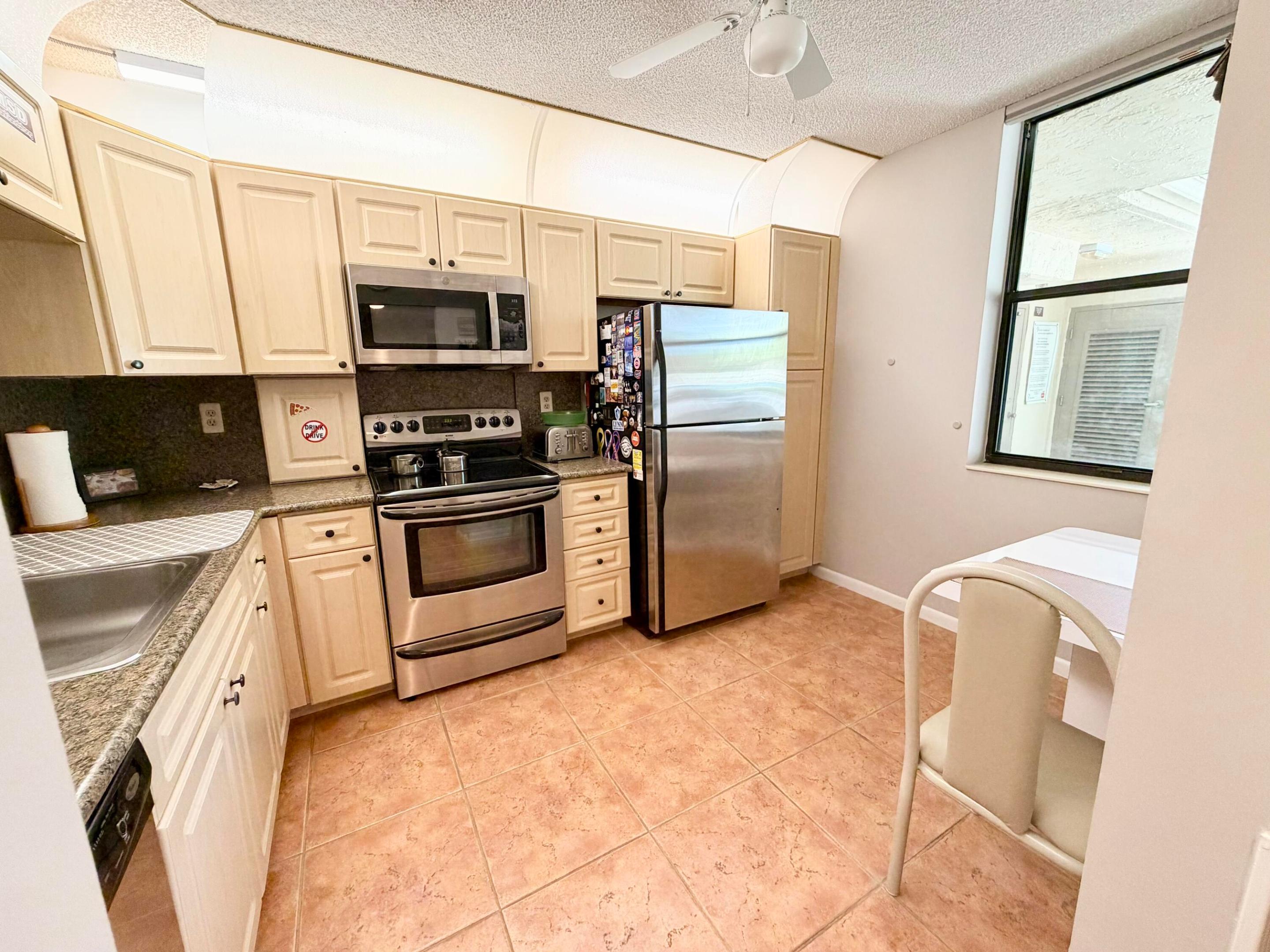 Located in the desirable Township community a spacious 1300 sq ft condo, 1st floor in an all age building. The open layout is spectacular and so comfortable. A separate laundry room for added convenience. Natural light pours in through the serene, views of the water and surrounding nature preserve, just beautiful and tranquil unobstructive views from living area & bedroom.  A/C approx. 2 years old, water heater 2014. Satellite pool, clubhouse & the Township offers so many activities & amenities as well. Make this your place today.