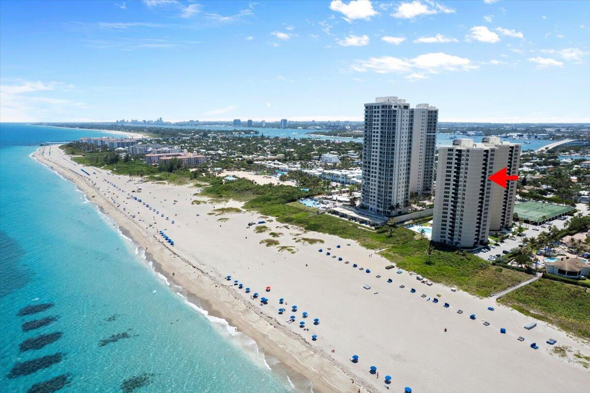 Enjoy beachfront living at its finest in this fully furnished 2-bedroom, 2-bath condo at Phoenix Towers on Singer Island. Take in stunning direct Atlantic Ocean and Intracoastal views from this move-in-ready residence featuring an updated open kitchen, renovated bathrooms, tile flooring throughout the main living areas, impact windows and sliding doors, and walk-in closets in both bedrooms. Phoenix Towers offers private beach access and resort-style amenities including a heated pool, fitness center, tennis courts, pickle ball courts, shuffleboard, clubhouse, grilling area, gated entry, onsite management, night security, and ample guest parking. Liberal rental policy makes this an excellent investment opportunity.