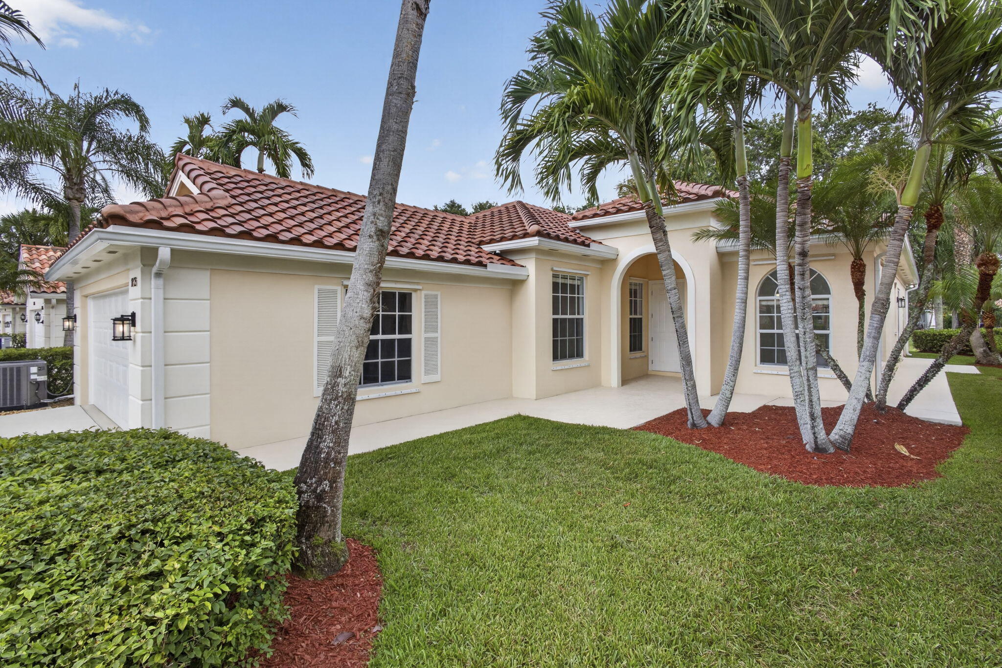 Move right into this beautifully updated 4-bedroom, 3-bath lakefront residence featuring a new roof, impact-rated sliding glass doors, new gutters, impact front entry door, and impact garage door—all installed in 2026—with transferable warranties on the roof and sliding glass doors. Additional upgrades include a newer central A/C system (2024), stainless steel kitchen appliances, newer washer and dryer in a dedicated laundry room, new fresh interior paint, brand-new carpeting throughout,  new central vacuum, 2 new toilets', and an active transferable termite protection plan for added peace of mind.  Designed for both comfortable living and entertaining, the spacious floor plan includes a versatile den ideal for a home office, media room, or guest space. A  screened lanai! The screened lanai overlooks a peaceful lake, creating the perfect setting to enjoy morning coffee or relax at sunset.  Located in one of West Palm Beach's most sought-after 24-hour guard-gated communities, residents enjoy a true resort lifestyle with a waterfront Town Center, on-site Italian restaurant, eight lighted Har-Tru tennis courts with a professional instructor and active tennis program, pickleball, three heated pools, a renovated fitness center, bocce, fishing, library, billiards, ping pong, beauty salon, children's playground, mail facility, and more than 12 miles of scenic walking and biking trails. An active social calendar featuring yoga, aqua aerobics, bridge, mahjong, crafts, and language classes offers something for everyone.  Conveniently located just minutes from shopping, restaurants, and Florida's Turnpike, this exceptional home offers the perfect combination of quality, comfort, and luxury resort-style living without the expensive country club fees.