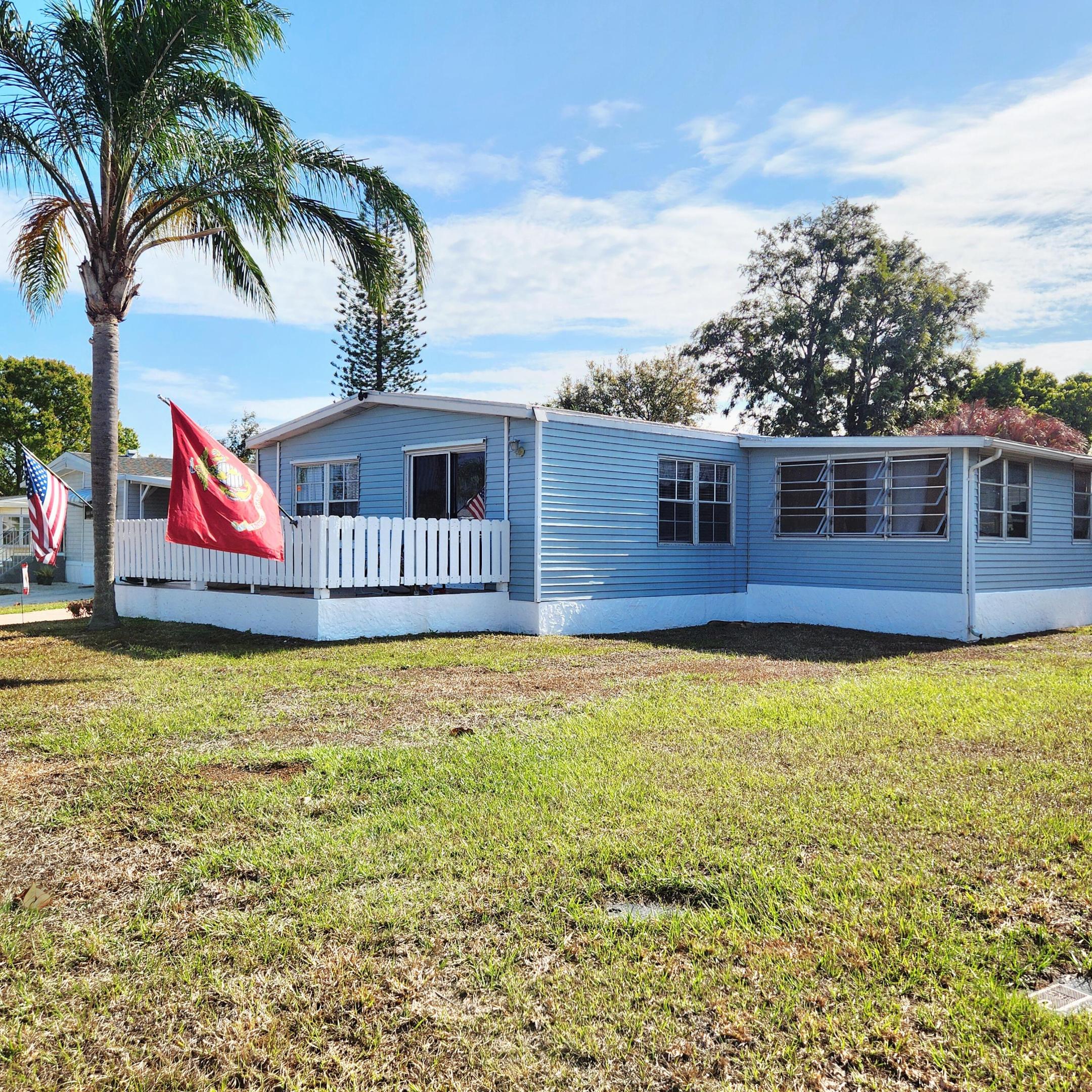 PRICED to SELL on this MUST SEE home w/ Roof sealed/coated 2023, AC 2019, HWH 2022! SPACIOUS 2bed/2bath home nestled on quiet cul-de-sac. Full Storm Shutters w/ automatic Shutter on SlidingGlassDoor. Outdoor spaces incl; Patio, Large Porch w/Picket Fence,ScreenedPatio great for Green Room, Relaxing, etc. Indoor, 20ft Screened Florida Rm doubles as Den/Extra Bedrm/Office! Modern Vinyl Flooring inside w/ Built-in Shelving & Ample Storage throughout. Custom Lighting. MasterBedroom offers en-suite &Walk-in closet. PrimeLocation; near Beach (NOFLOODZONE),Grocery,Shopping, Postal,Banks,Pharmacy,Hospitals & more. Lot Lease 930.98 includes Security,Cafe,Clubhouse w/activities,Lawn,Trash,FreePrivate Golf,HeatedPool, Pickleball/Tennis,Shuffleboard,Bocce,Gym,Library, Cards,Mahjong,Bingo,Clubs & more!