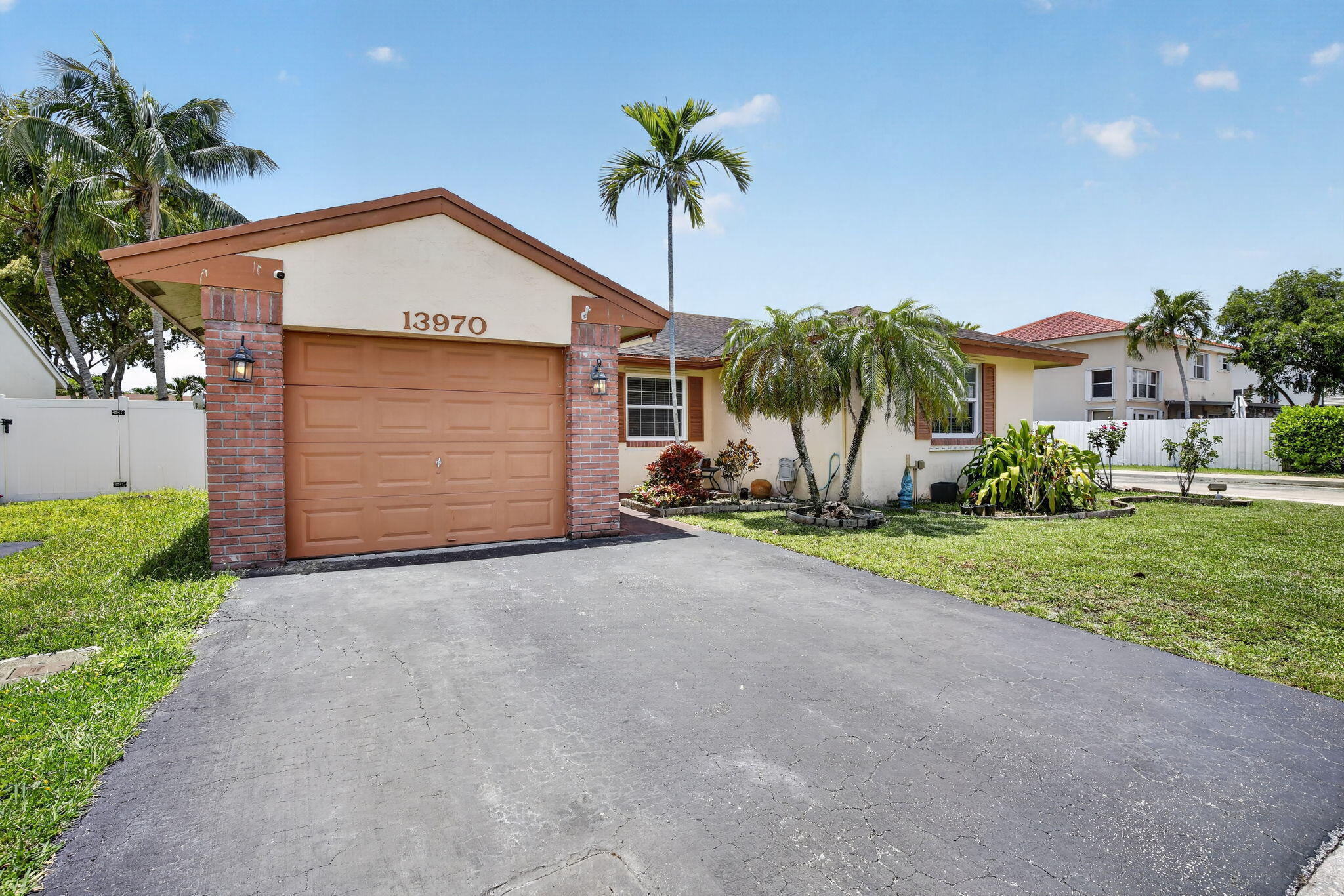 Welcome to Shenandoah in Davie! This move in ready home features hurricane impact windows, A/C (2019), updated kitchen with modern cabinetry, tile countertops, and backsplash, plus a remodeled primary bedroom with new flooring, crown molding, French doors, walk in closet, and upgraded en suite bathroom with spacious shower enclosure. Enjoy a private fully fenced backyard with covered patio, trellis pergola, faux ivy wall, and plenty of room for entertaining. Conveniently located near top rated schools, parks, shopping, dining, and major highways. Seller is actively searching for a replacement home and is motivated to work with qualified buyers on timing. Rare opportunity in one of Davie's most sought after communities.