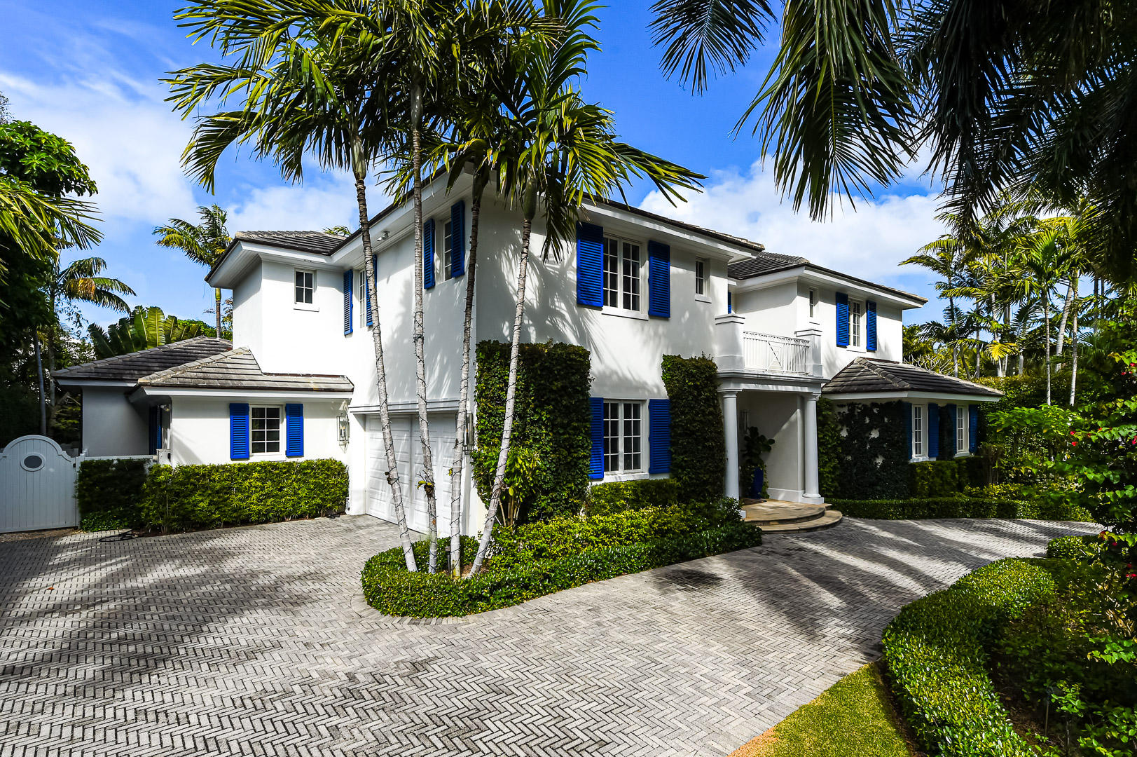 Gorgeous, light and bright British Colonial built in 2008 with 6 bedrooms, 7 bathrooms, and 1 powder room. Highlights include formal dining room, elevator, 2-car garage, and double height foyer and living room. Oversized gourmet chef's kitchen with top-of-the-line appliances opens to family room with beautiful built-ins. Stunning owner's suite with large balcony and dual baths and walk-in closets. Spectacular outdoor spaces feature lush tropical landscaping, pool with spa, covered loggia and open patio perfect for outdoor entertaining.