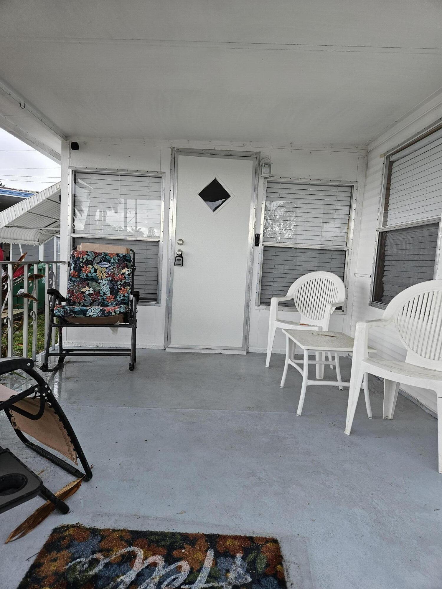 Charming 2 Bedroom, 2 full bathrooms in this well maintained 55 and older community. YOU OWN THE LAND. NO LOT FEES.  This home is equipped with a ramp for wheelchair access.  Partially Furnished.