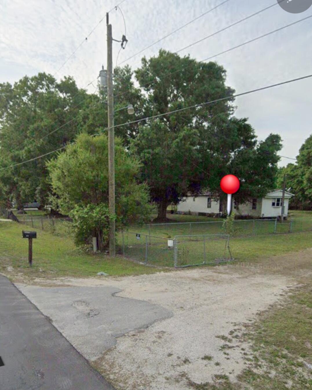 Basswood~ Mobile Home: Oversized Lot, 2Bed & 1Bath, offers a great opportunity for investors, renovators, or buyers looking for a project. The property features, multiple parking spaces, metal roof, fenced and gated, on septic, electric available,  city water, No HOA, in growing community,  closed to amenities, great schools, hospital, shopping and local stores, The home will require repairs, updates, and improvements before occupancy. Being sold as-is. Excellent potential for those looking to restore, renovate, or add value.