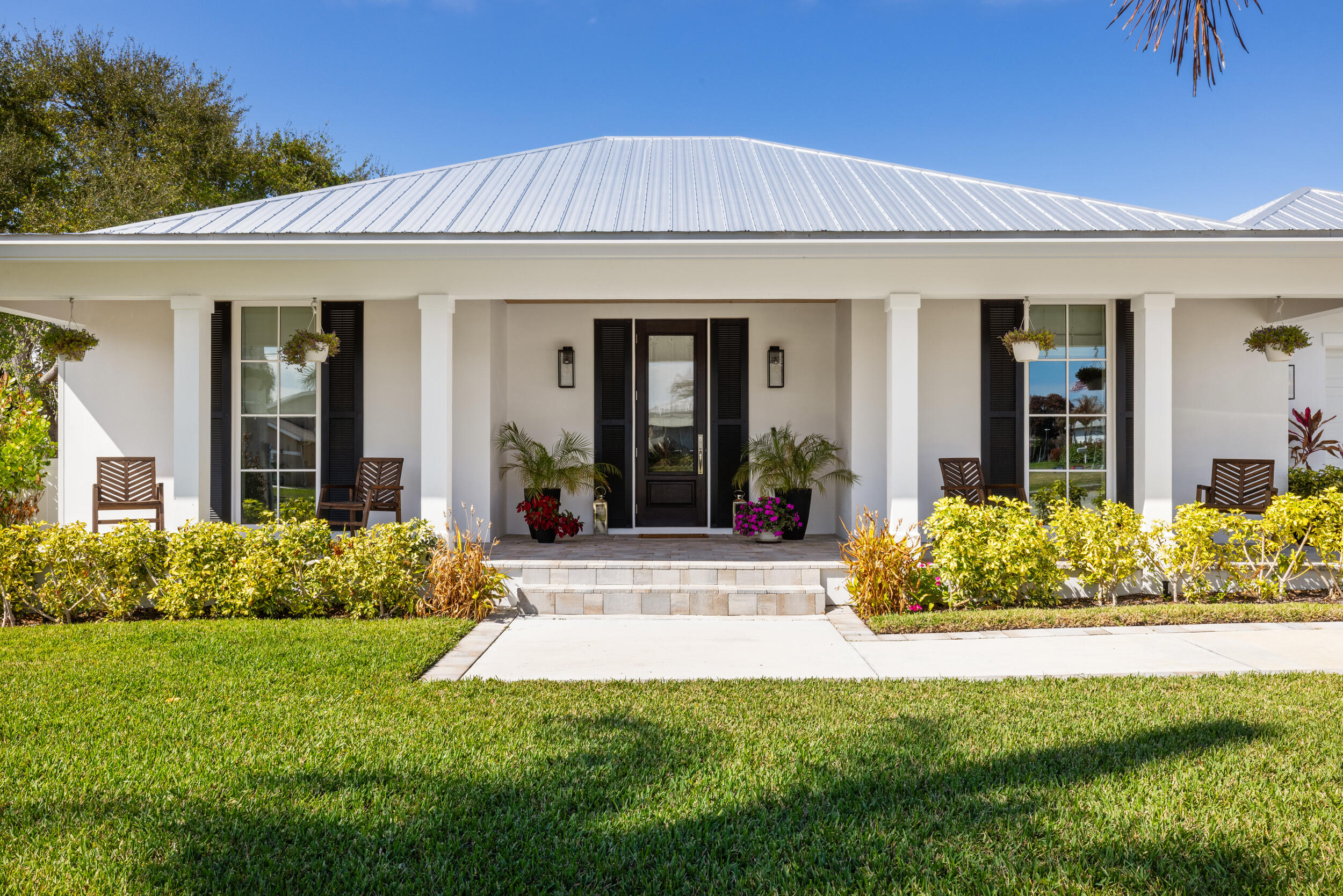 Built in 2023, this custom-designed, energy-efficient home offers exceptional curb appeal and modern coastal living on a 0.23-acre lot. The residence features high-end finishes throughout and the peace of mind of a whole-house generator. Enjoy deeded water access just down the street, and cruise across Manatee Pocket to Historic Port Salerno Village for waterfront dining, fresh local seafood, live music, and art galleries. Saint Lucie Inlet and the popular sandbars are not far away, making this a true boater's paradise. Located on the desirable Rocky Point Peninsula, you're also a short bike or golf cart ride to Twin Rivers Park and Maggie's Hammock for scenic trails, green space, and outdoor recreation.