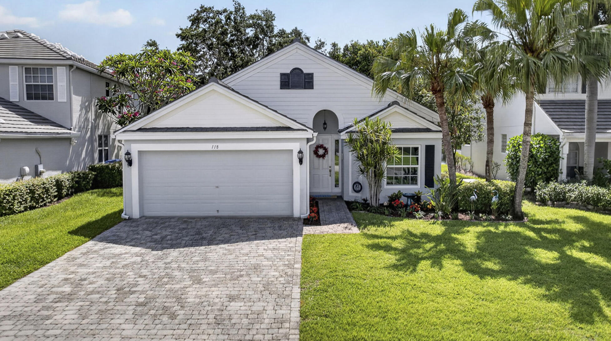 Beautifully maintained 3-bedroom, 2.5-bath home located in The Estates section of the highly sought-after gated community of Victoria Grove. Features include a newer roof, impact glass and doors, and a Generac generator for added peace of mind. From the moment you enter the front door, this home feels light, bright, and airy, with high ceilings and a stunning wall of windows & French doors. It draws your eye straight through to the extended patio with tranquil water views and mature shade trees. Step outside to the lovely extended patio - the perfect setting for entertaining while enjoying peaceful waterfront views. The bright, open and spacious living and dining areas flow seamlessly into the gorgeous updated open-concept kitchen featuring black stainless-steel appliances. The kitchen also offers a gas range, Quartz countertops & backsplash and abundant real wood cabinetry with pull-out drawers. This well-designed floor plan offers generous living spaces ideal for both everyday living for families and entertaining.  Additional features include a 2-car garage, crown molding, and surround sound speakers. Victoria Grove HOA amenities include a 24/7 manned security gate, cable, high-speed internet, lawn care, a resort style community pool with a jacuzzi, and clubhouse. It also includes a pickleball court, park, fitness center and more. A lovely gated neighborhood with gazebos and beautiful sunset water views. Conveniently located just minutes from shopping, dining, equestrian venues, Wellington Green Mall, and the new Lotis Plaza. Easy access to major roadways makes commuting simple. Close to WEF and polo venues. Schedule your private tour today before this exceptional home is gone!