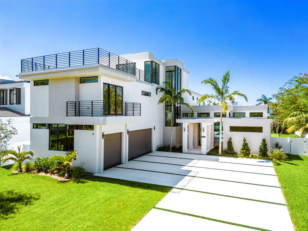 Welcome to a new contemporary masterpiece in the Golden Triangle. Sitting on nearly 1/3 of an acre, this stunning 5,683 sf (under air) and 7,903 sf (covered) home boasts 5 ensuite bedrooms, 7.5 baths, a study (which may serve as an additional bedroom) and a glass enclosed 3rd floor with its own ensuite bathroom. Walk through the covered entry loggia and step into the foyer that leads to a thoughtfully designed open concept view, revealing the chef's kitchen (Wolf and subzero appliances), dining room, great room, club room, enclosed wine racks and feature wall with fireplace. The main floor includes a large VIP suite with his and her walk-in closets, dual vanities, a large walk-in shower and a beautiful tub. The spacious yard boasts 2 separate covered patios, saltwater pool, hot tub and a large free standing entertainment gazebo with summer kitchen.

The second floor contains the primary suite with morning bar, his and her walk-in closets and individual his and her bathrooms along with a private balcony overlooking the pool grounds.

Take the elevator or floating stairs to the sun soaked third floor which can serve as a bedroom, entertainment space or inspiring exercise room with a sun deck boasting a an inspiring view of the Golden Triangle.

Enjoy walkability to Mizner Park's famous shops and fine dining. Just a few minutes away from Boca Raton's intracoastal parks and spectacular beaches. This stunning home is for the buyer who wants to live in luxury and be in the center of everything fun and exciting that happens in Boca!

Additional details - Three-car garage. Washer and dryer on both the main and second floor. Prewired low voltage electrical plan for automatic blinds. Central vacuum system. 2 tankless hot water heaters.

Developed by Fawn Valley Properties, this estate home was designed by JAO Architects and Planners, includes interiors designed by The Decorators Unlimited and construction by Beach to Bay Custom Builders. These renderings are for illustrative purposes only and are subject to change.