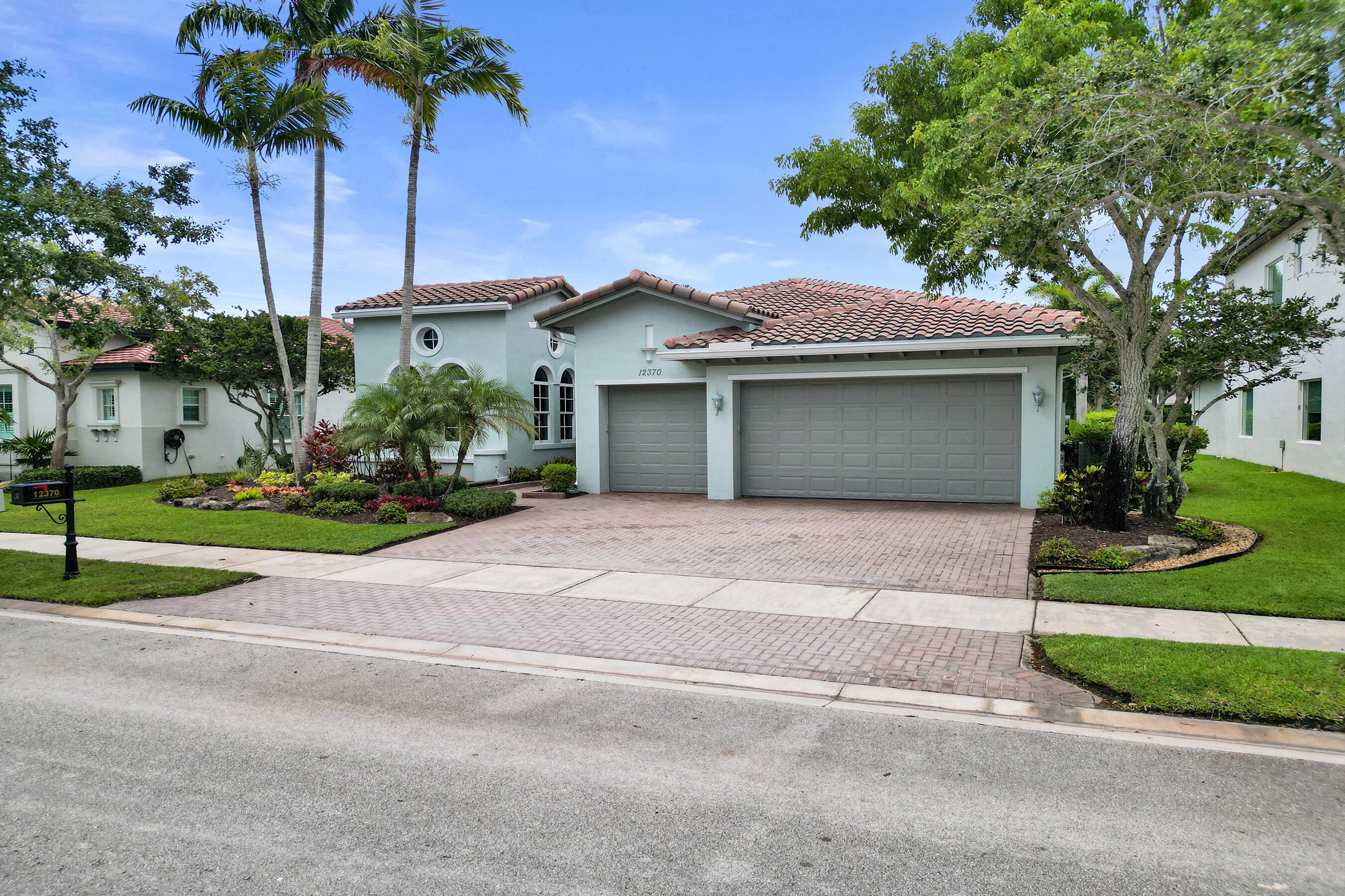 Welcome to this beautiful tranquil, lake front/pool beauty, 3 car garages, 4-bedrooms, 3-bathrooms single-story residence offering open bright and inviting split floor plan in gorgeous Heron Bay, Parkland. New Roof installed in 2024 and AC is also brand new. The home has high ceiling throughout the floor plan gives you options for versatility of use with grand kitchen, dining and family combination with a large area adjacent to kitchen for formal dining, living or game room. Large covered patio overlooking the pool and lake, allows you to opportunity to maximize Florida living year round. Enjoy manned gates, two club houses, mature landscaping, kids play park, Splash Park, multiple tennis, basketball, pickle ball courts, racquetball, 2 gyms, Resort style pools and more! Great Opportunity!