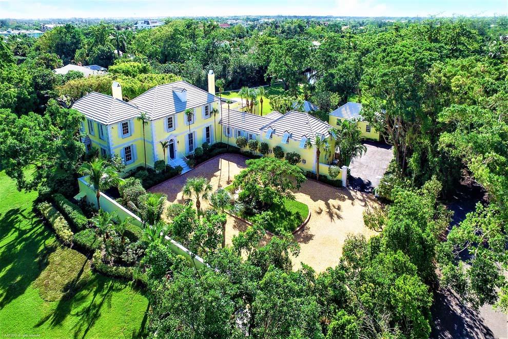 Situated on 2.63 acres across from the Atlantic Ocean and just north of Delray Beach’s Atlantic Avenue, Lemon Hill is a grand waterfront estate designed by society architect Marion Sims Wyeth. The private compound offers a main house, guest and caretaker houses, resort style pool and sprawling grounds overlooking the Intracoastal Waterway. Perfect for entertaining, the property has seven bedrooms, graceful spiral staircase, formal living and dining rooms, cypress-paneled library, coffered ceiling loggia, elevator and expansive kitchen and breakfast room. Lemon Hill honors the genius of Wyeth’s architecture, proudly taking its place amongst his other masterpieces including Palm Beach’s Mar-A-Lago, Honolulu’s Shangri La and the Florida Governor’s Mansion. Welcome to Lemon Hill, a majestic waterfront estate on 2.63 acres, designed by society architect Marion Sims Wyeth. Created with a timeless elegance, Lemon Hill embraces the allure of Wyeth's architecture. It proudly takes its place among other Wyeth masterpieces, including Mar-A- Lago in Palm Beach, Shangri La in Honolulu and the Florida Governor's Mansion in Tallahassee. The secluded and expansive parcel is perfectly nestled beside a 3.5 acre protected nature preserve and at the end of a quiet canal just off the Intracoastal Waterway. With 65 feet of water frontage and easy access to the ocean via nearby inlets to the north and south of the property, Lemon Hill is a boater's dream. Located one mile north of the shops and restaurants along Delray Beach's Atlantic Avenue, it is the perfect start to a scenic drive along A1A to Palm Beach, Boca Raton, Fort Lauderdale and all seaside towns in between. There are three international airports and several private jet-ports nearby with easy access via Interstate 95 or Federal Highway.

The property's entrance is accessed by a lush, canopied, private road that ascends through the landscaped grounds to the circular drive and the gracious front door of the Georgian manor. The entryway and foyer unveil the classic touches of Wyeth's designs, including the grand curved staircase, arched doorways and high ceilings. Included in the foyer are a generous coat closet and elegantly appointed elevator. There are lovely views from here looking through the loggia to the pool terrace's giant ficus trees laden with stag horn ferns. The Cuban stone tiled main hallway leads from the cheery foyer and connects the main rooms on the first floor.

The generous living room exudes warmth with its original wood parquet floors, large fireplace, crown dentil moulding, standing bay window and unique rectangular seating alcove. Picturesque views of the expansive, manicured grounds abound as light pours through the large windows and French doors that open to the pool terrace. Pocket doors lead to the sunny loggia. The powder room, with its charming anteroom, is located off the main hallway, beside the living room. The formal dining room is of a grand scale and also has views through the loggia of the pool house and gardens via thanks to the loggia's huge 9-foot sliding glass doors. The dining room boasts enormous Jeffersonian triple-hung windows and polished parquet floors. The cypress-paneled library offers incredible views of the pool as well as the gently sloping hill to the water. This fabulous room has unique touches including custom shelves and hidden cabinets, fireplace, second powder room and exquisite full bar room with hidden pass-through panel to the kitchen. Tall pocket French doors open from the library to a covered dining terrace and outdoor summer kitchen. The views from the massive table and chairs down the hill to the water serve as a spectacular, serene backdrop to any gathering. Sure to be a favorite gathering spot, the spacious loggia is centrally located off the main hallway and is accessible from each of the first floor formal rooms. With its cypress coffered ceiling and full-length sliding glass doors that completely open, this gorgeous space easily invites the outdoors in, allowing gentle breezes to enhance the impressive views of the terraces, pool and gardens.

The main curved staircase gracefully leads from the foyer to the second- floor landing which features hardwood floors and elevator access as well as a lovely view of the front grounds and fountain garden. The upstairs has two main hallways; the south hallway leads to the master wing and guest suite, while the north hallway leads to the back stairways: up to the attic and down to the kitchen. The master wing with separate his-and-her dressing suites is a sublime space with everything needed for a luxurious escape from routine. The master bedroom provides tranquil views through its tall windows of the sprawling grounds, pool and waterway. His-and-her dressing suites are well appointed with ample closets and built-in dressers. Her bathroom has a shower and separate tub and water closet. His bathroom has a walk-in shower and access to the upper balcony for enjoying morning coffee or afternoon sunsets. The upstairs guest suite features hardwood floors, custom molding, large closets, charming window bench and balcony access. The full bath includes a large closet and pass-through hallway with built-in dresser.

Lemon Hill's large kitchen is the perfect spot for creating fine cuisine or enjoying a meal in the breakfast room. Included are Kitchen Aid double ovens, Sub Zero side-by-side refrigerator and freezer, two dishwashers, two sinks, pantry, built-in ice machine and Thermador five-burner gas range. Ample counter space, hardwood floors, glass-front cabinets and custom tile backsplash help to make the space a delightful place to create. The kitchen opens to a large breakfast room with a standing bay window and warm cove lighting. The kitchen garden and fountain lead the eye from the breakfast room down past banyan trees to the water beyond.

The two west wing guest suites are located at the top of the kitchen stairway and each have hardwood floors, dormer windows, ample closets and full baths. These rooms offer a private location and could be used for residents, guests or staff. The separate laundry room, additional powder room and two-car garage are located down a small staircase off the kitchen. The back door leads from the laundry room to the back parking area and service drive beyond.

The large pool is ideally located atop the hill between the main house and pool house surrounded by terraces and towering ficus trees. The pool/ guest house has an open floor plan that includes a living area, kitchenette with snack bar, a bedroom and large closets as well as a full bath with a separate hot water heater. The pecky cypress ceiling over the covered terrace serves to enhance the serenity of the beautiful natural surroundings. Outdoor landscape lighting glorifies the breathtaking grounds at night. The caretaker/mother-in-law house is located behind the main house and is fully equipped with two bedrooms, two bathrooms and a galley kitchen. There is an additional out building with a half-bath that can be used as a gardening house or workshop.

The historical value and aesthetic presence of this waterfront Marion Sims Wyeth residence is beautifully enhanced by the uncompromising and unrivaled 2.63 acre land parcel east of the Intracoastal Waterway. Situated atop a coral ridge, Lemon Hill enjoys a unique high elevation. Stunning sunset vistas over the lush property and down the hill to the water are a stand-out. Privacy and security is furthered by an alarm system and automatic back-up generator as well as automatic and accordion hurricane shutters. 

The current owners have honored this Wyeth masterpiece by lovingly and meticulously maintaining all aspects of the residence for two decades. Two of South Florida's rarest commodities combine to create this unrivaled real estate opportunity: A Wyeth-designed home located on an unparalleled parcel of land in the town of Gulf Stream. This is truly a "once-in-a-lifetime" p