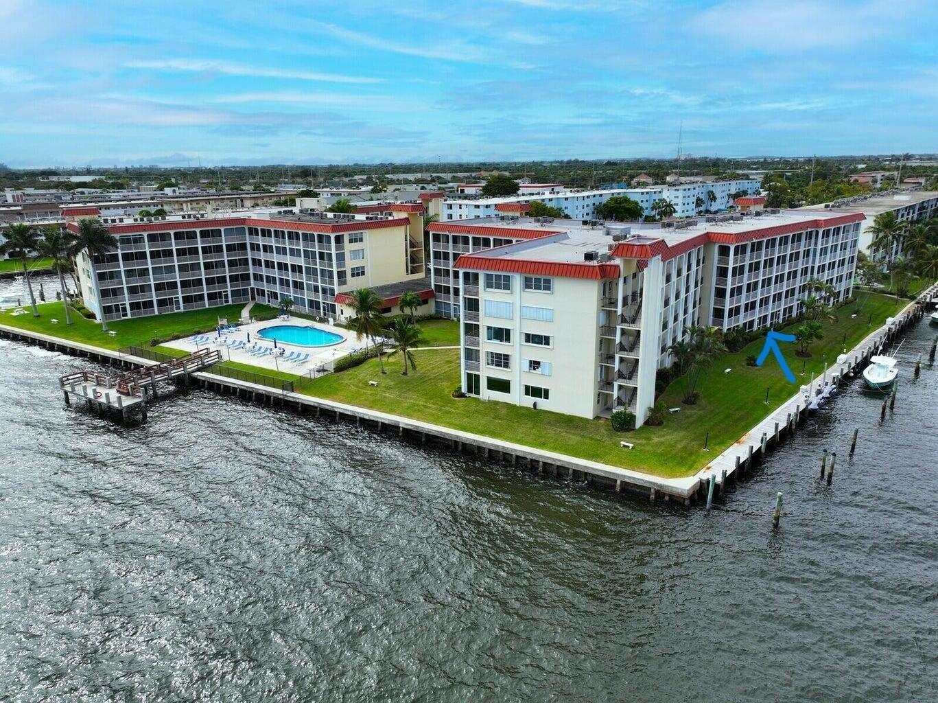 This gorgeous ground floor condo has wide Intercoastal views and exquisitely renovated with no expense spared. Featuring custom cabinetry with well-appointed stainless-steel accents, boasting bold and contemporary quarts countertops, and designer inspired exposed concrete columns that add a chic and modern look. There is elegant Italian porcelain tile throughout and a magnificent and luxurious Italian tiled bathroom. The elaborate recessed lighting system is utilized through an internet phone app allowing dimming settings and an array of color options, with syncing music applications like Spodify. Other unique upgrades and features include USB electrical outlets throughout to charge your electronics, a hardwired internet TV connection, and a water filtration system throughout the home. There are boat slips available for purchase by individual owners. Dogs are allowed as emotional support animals, the association is lenient, just need the paperwork and any size dog is acceptable. Cats and other pets are allowed but have to be disclosed.