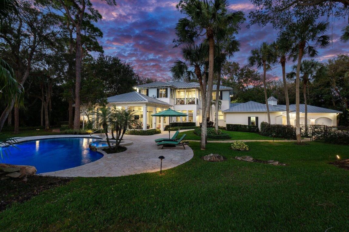 This property at 16356 Bridlewood in Delray's esteemed Fox Chase community truly exemplifies luxury living. With only 43 estate homes, this exclusive neighborhood is celebrated for its spacious and rare lot sizes, ensuring both privacy and unmatched grandeur.

The home itself boasts timeless architectural design by KAUFMAN-LYNN.    Custom, high-quality finishes from towering solid core doors to high ceilings and intricate custom cabinetry and woodworking, every detail speaks of elegance. The wide plank hardwood flooring throughout adds warmth, creating an inviting atmosphere perfect for entertaining guests or enjoying quiet family moments.

Set on over an acre, the generous setback enhances the home's stately presence, featuring a large auto court and a four car garage for ample parking. The oversized backyard is a true oasis, complete with an outdoor kitchen, a large covered patio for shaded relaxation, natural coquina pavers that enhance the outdoor aesthetic, and a resort-style pool and spa that promises endless leisure and enjoyment. This property is not just a home; it's a lifestyle.