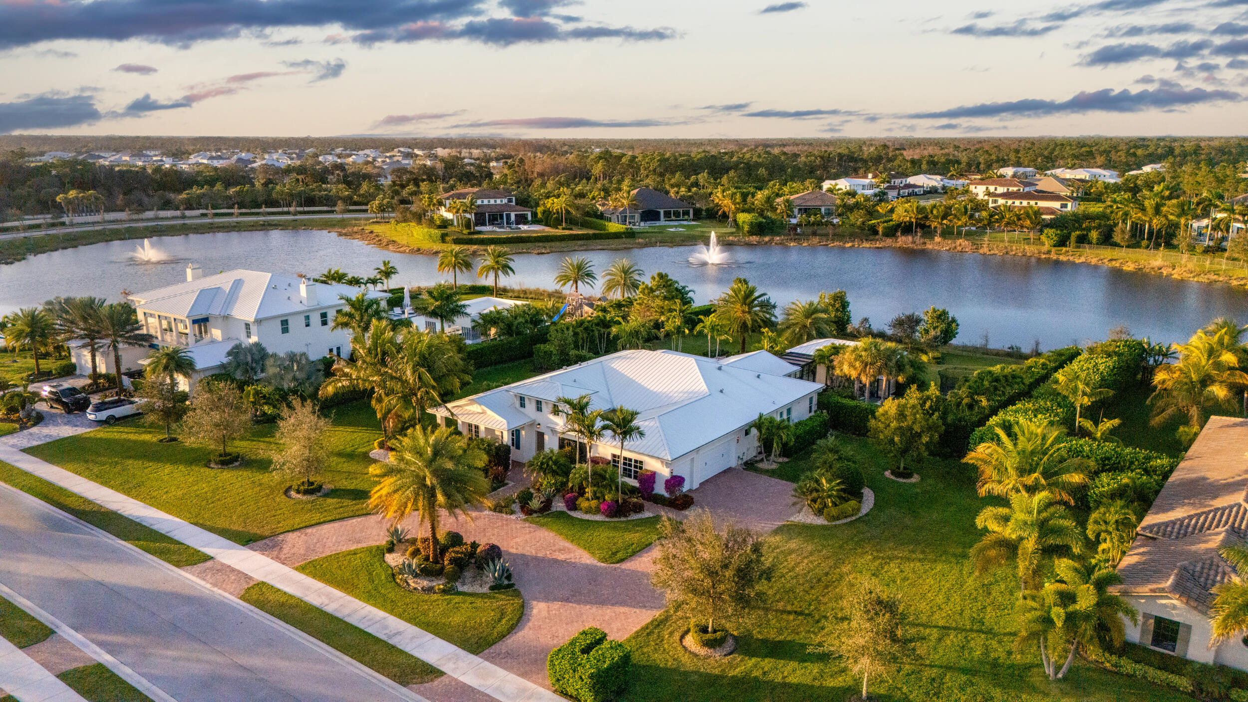 THIS HOME HAS IT ALL! Welcome to 8001 SE Old Plantation Circle, located in the highly sought after Jupiter community, Prado. Sitting on 1-acre designed by In-Site Studio, this home boasts 4,166sf of living space with 4b/5.5b in the main house, as well as a rare 1b/1b guest house. As you step through the entry portico, you'll be greeted by a serene atmosphere created by lush landscaping, a tranquil water feature, and a custom hanging daybed. Interior designed by Palm Beach's renowned McCann Design Group, this home offers a chic yet timeless feel throughout the home. An extensive list of upgrades include a guest house, wallpaper finished rooms and bathrooms, California Closets built out in bedrooms, Control 4 with surround sound both inside and out, hardwired camera system, phantom screens and much more. Zero corner sliding doors create the perfect transition for both indoor and outdoor entertaining. With a resort style feel, you'll find the pool and spa framed by the outdoor summer kitchen with twin eagle appliances, a pergola connecting to the guest house, and oversized fire pit. A full cabana bath and a separate outdoor shower keeps outdoor living all in one place. If you're looking for a property and home that truly offers you an entertainers paradise and endless possibilities, then you look no further!