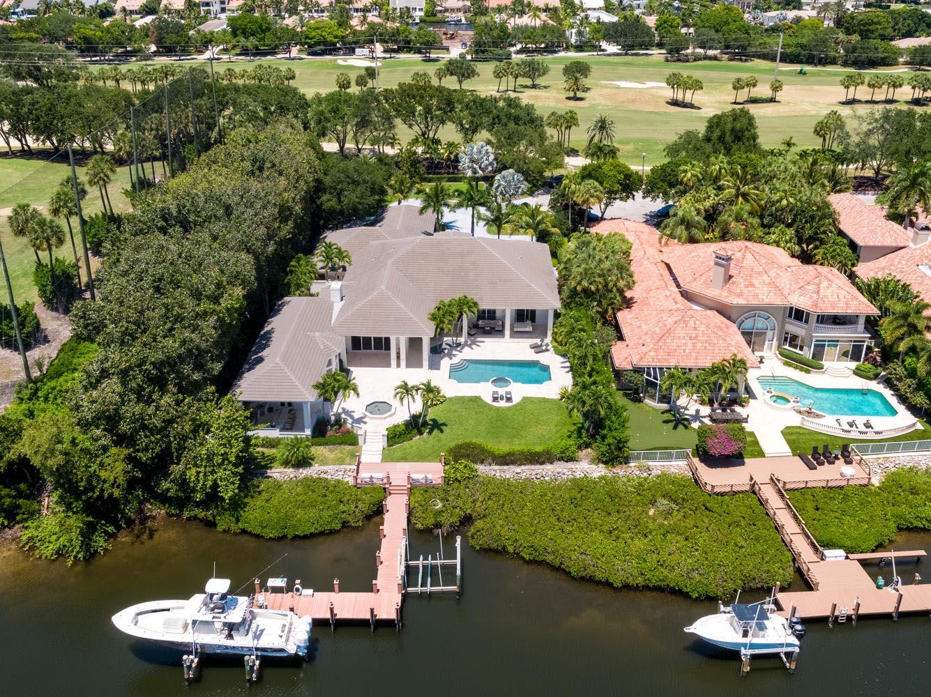 Waterfront state of the art ''smart home'' on oversized cul de sac lot featuring 120' of prime water and spectacular views. Huge master suite with his and her baths and custom closets plus 4 large bedroom suites w/full baths. Chef's kitchen with large quartz dine at island, modern top of line appliances, solid wood custom cabinetry and full built in bar. Amazing family room includes full bar, pool table, media system and full bath with steam shower. Summer kitchen features large counter, grill and pizza oven. Resort style pool/spa and patio includes a very large backyard and dock has 2 lifts and property can accommodate up to 65 feet.