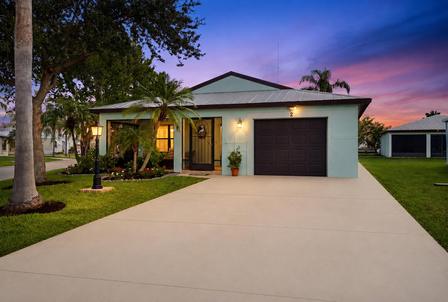 Beautifully updated CBS home that has been impeccably maintained and thoughtfully upgraded throughout! Enjoy lasting peace of mind with a metal roof, impact windows and doors, newer A/C, updated electrical, and a generator hookup. Inside, you'll find a bright, modern interior featuring quartz countertops, a glass tile backsplash, stainless steel appliances, waterproof laminate flooring, and fresh interior paint. Outside, the oversized corner lot is beautifully landscaped and offers a private, bamboo-lined backyard perfect for relaxing or entertaining.  Residents enjoy an incredible array of amenities, including FREE golf, tennis, heated pools, a spacious clubhouse, and so much more. Ideally located near US-1, shopping, dining, and major highways, you're also just 15 minutes from the  pristine beaches of Hutchinson Island, making this the perfect place to enjoy the Florida lifestyle.