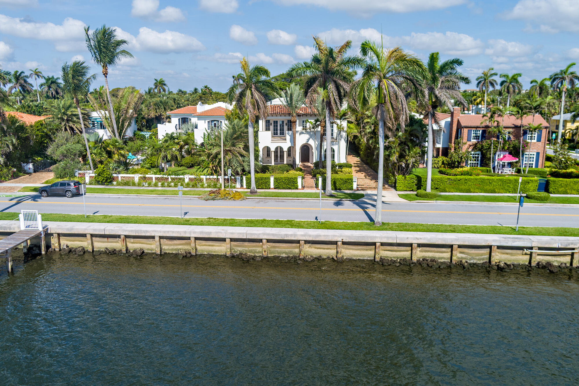 Enjoy over 60 feet of prized Intracoastal waterfront on coveted South Flagler Drive, where you can build your own private dock and soak in breathtaking views of Mar-a-Lago. This 5-bedroom, +/- 6,000 sqft, CBS-built masterpiece (2008) wraps you in pristine luxury — full hurricane impact windows and doors, an elevator, reverse osmosis water system, two car garage and an expansive covered loggia perfect for unforgettable entertaining. The oversized primary suite boasts a private balcony, while the rooftop pool offers dazzling Intracoastal and city views. Close to beaches, Worth Ave., and PBIA. DISCLAIMER: The written and verbal information provided including but not limited to prices, measurements, square footages, lot sizes, calculations and statistics have been obtained and conveyed from third parties such as the applicable Multiple Listing Service, public records as well as other sources. All information including that produced by the Sellers or Listing Company are subject to errors, omissions or changes without notice and should be independently verified by any prospect for the purchase of a Property. The Sellers and Listing Company expressly disclaim any warranty or representation regarding all information. Prospective purchasers' use of this or any written and verbal information is acknowledgement of this disclaimer and that Prospects shall perform their own due diligence. Prospective purchasers shall not rely on any written or verbal information provided when entering a contract for sale and purchase. Some affiliations may not be applicable to certain geographic areas. Copyright 2023 Listing Company. All Rights Reserved.