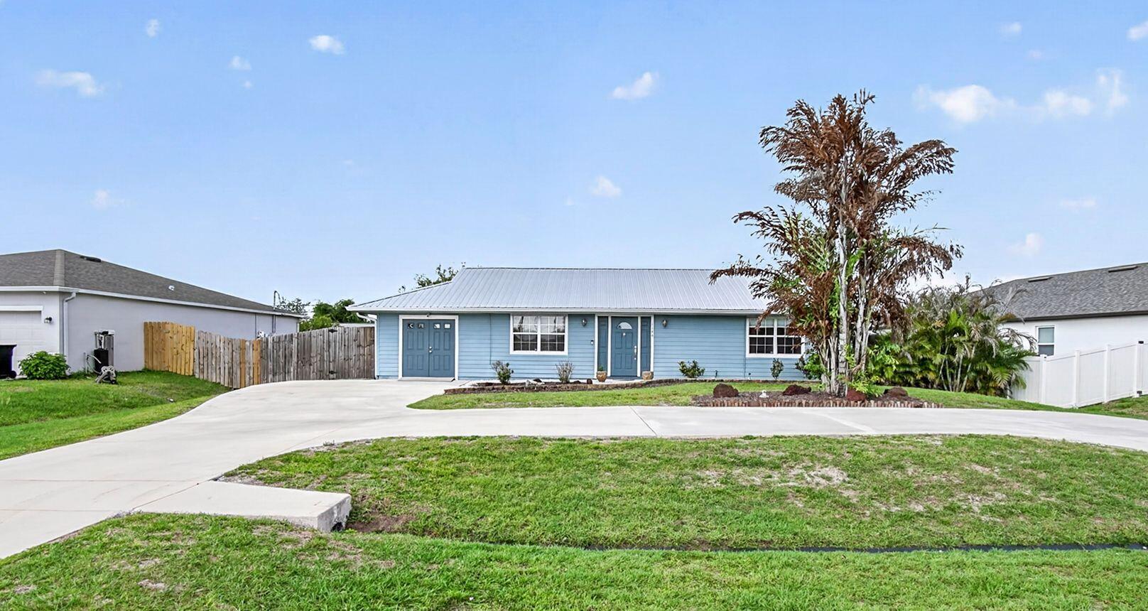 Welcome home to this perfect cozy house.  The 2 bedroom 2 bathroom open concept includes a large flex room full of possibilities.  The fenced in backyard is great for entertaining, relaxing and enjoying nature. Metal Roof 2023. Close to I-95, the Turnpike, schools, shopping, restaurants, and so much more.