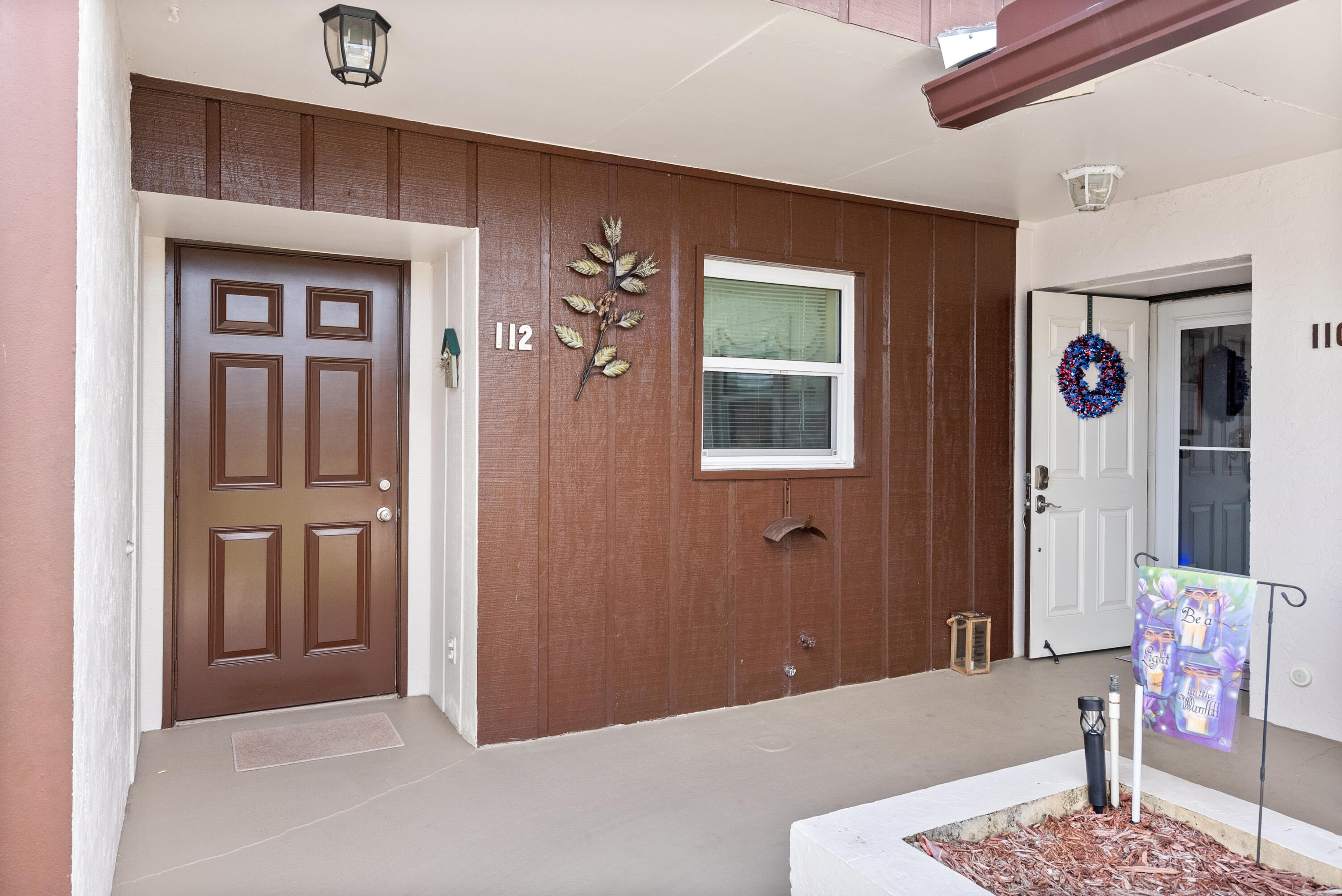 Welcome to this beautifully maintained 2/2 first-floor end unit in desirable Twin Lakes. Covered carport steps from your door and a light, bright open plan. Peace of mind with 2022 PGT impact windows, white tile in living areas, in-unit washer/dryer, a primary with walk-in closet, and a large guest room with wall-length closet. Enjoy a Florida room with storage, tropical garden view, and direct outdoor access. Twin Lakes, an active 55+ community, offers heated pool, barbecue, fitness, billiards, sauna, tennis/pickleball, library, and community room. Dues include cable, building insurance, and maintenance. One pet under 15 lbs welcome; lease immediately. Near beaches, downtown Stuart, Jupiter, dining, and shopping.