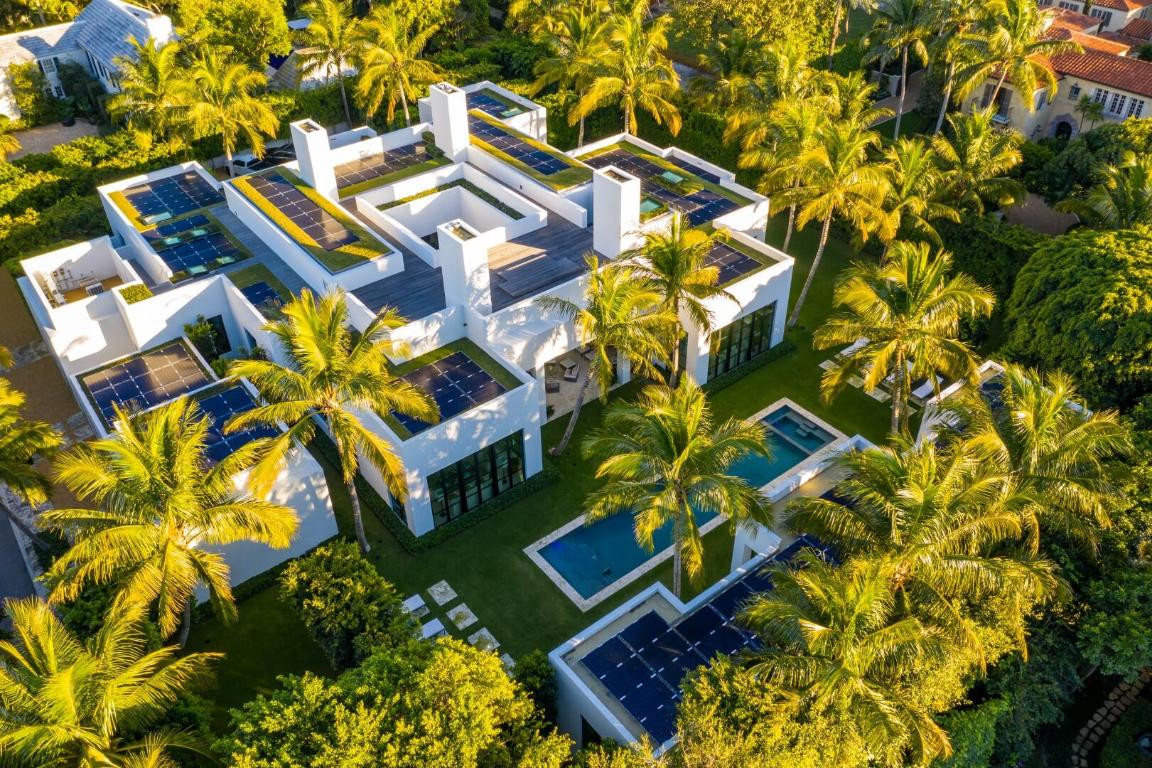 Striking and refined Classical Modern one-story estate built in 2016. 6BR/6.3BA, 12,914+/- SqFt home with separate guest house beautifully designed around interior courtyard. No detail has been overlooked in this spectacular custom estate. Perfect for entertaining with expansive living spaces including formal living room with fireplace, formal dining room, and billiards room. Highlights include library, office, home gym, and family room. Estate features exceptional energy sustainability with 200+/- solar panels hidden and surrounded by rooftop gardens. Inviting outdoor spaces include dining patio and fantastic loggia, rooftop lounge, cabana, and 55'+/- lap pool with sun shelf and spa. Soaring 15'+/- ceilings in the living room and 14'+/- ceilings throughout. 12'+/- steel frame French doors throughout bring in an abundance of natural lighting. Gourmet top-of-the-line chef's kitchen with oversized eat-in island, buffet room, and separate prep kitchen. Stunning finishes throughout including gorgeous oak flooring. Guest house includes two guest suites with ensuite baths and dual sinks. Winner of the Preservation Foundation's 2019 Schuler Award. Designed by Daniel Kahan of Smith and Moore Architects, built by David General Contracting, and exteriors designed by landscape architect Mario Nievera of Nievera Williams Design. Located in Palm Beach's fabulous Estate Section.