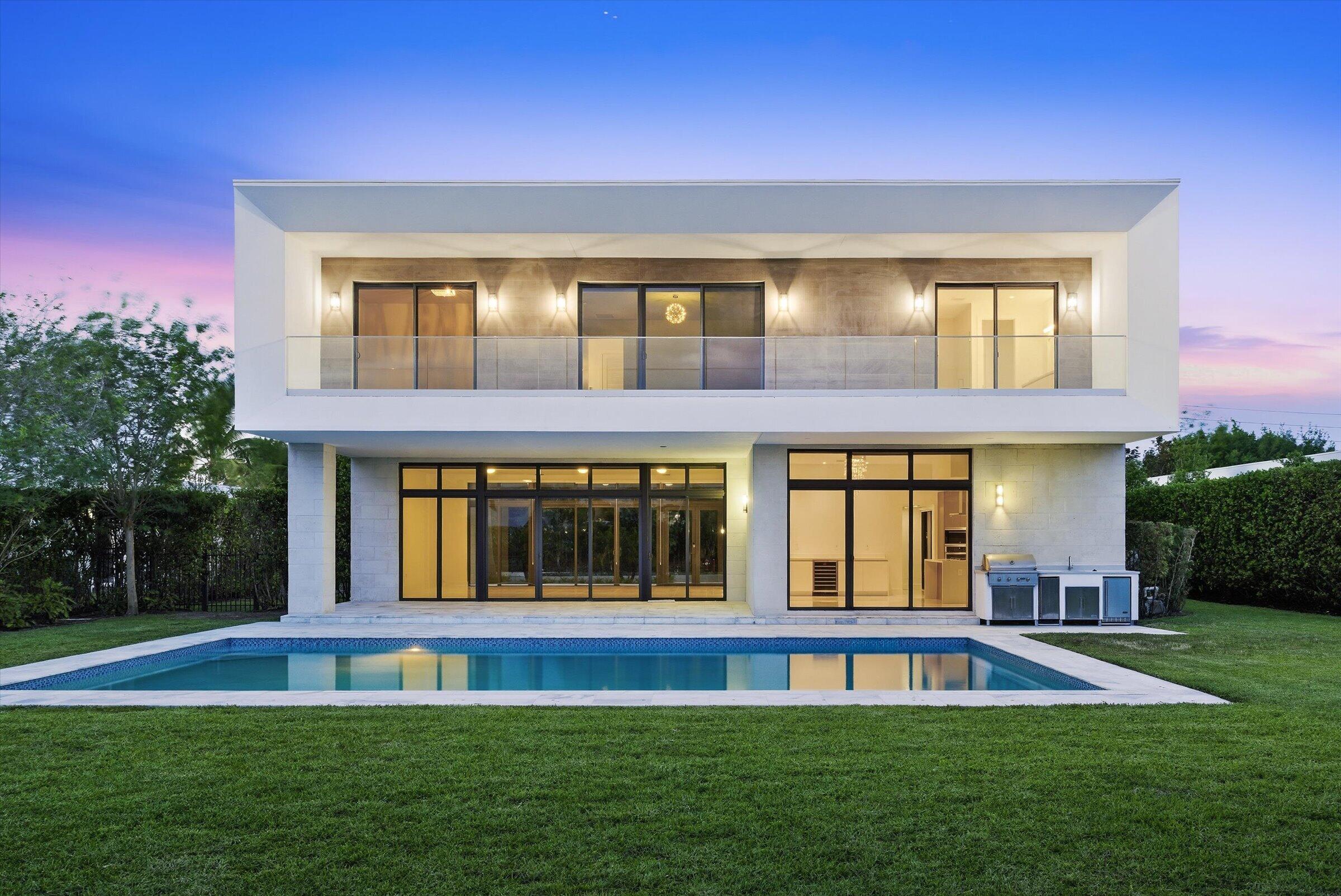Spectacular lakefront residence in the exclusive Botaniko community in Weston—a private enclave of modern homes designed by renowned architects. This exceptional property features 5 bedrooms plus a dedicated office and 6.5 bathrooms. Interior highlights include porcelain tile flooring in the main living areas and hardwood floors throughout the bedrooms and staircase. The home offers an open-concept layout with a sleek Italian kitchen equipped with top-of-the-line appliances. Outdoor living is elevated with an oversized pool, expansive covered patio, and fully equipped summer kitchen—ideal for entertaining. Additional features include a wraparound balcony, oversized driveway, and a 3-car garage.