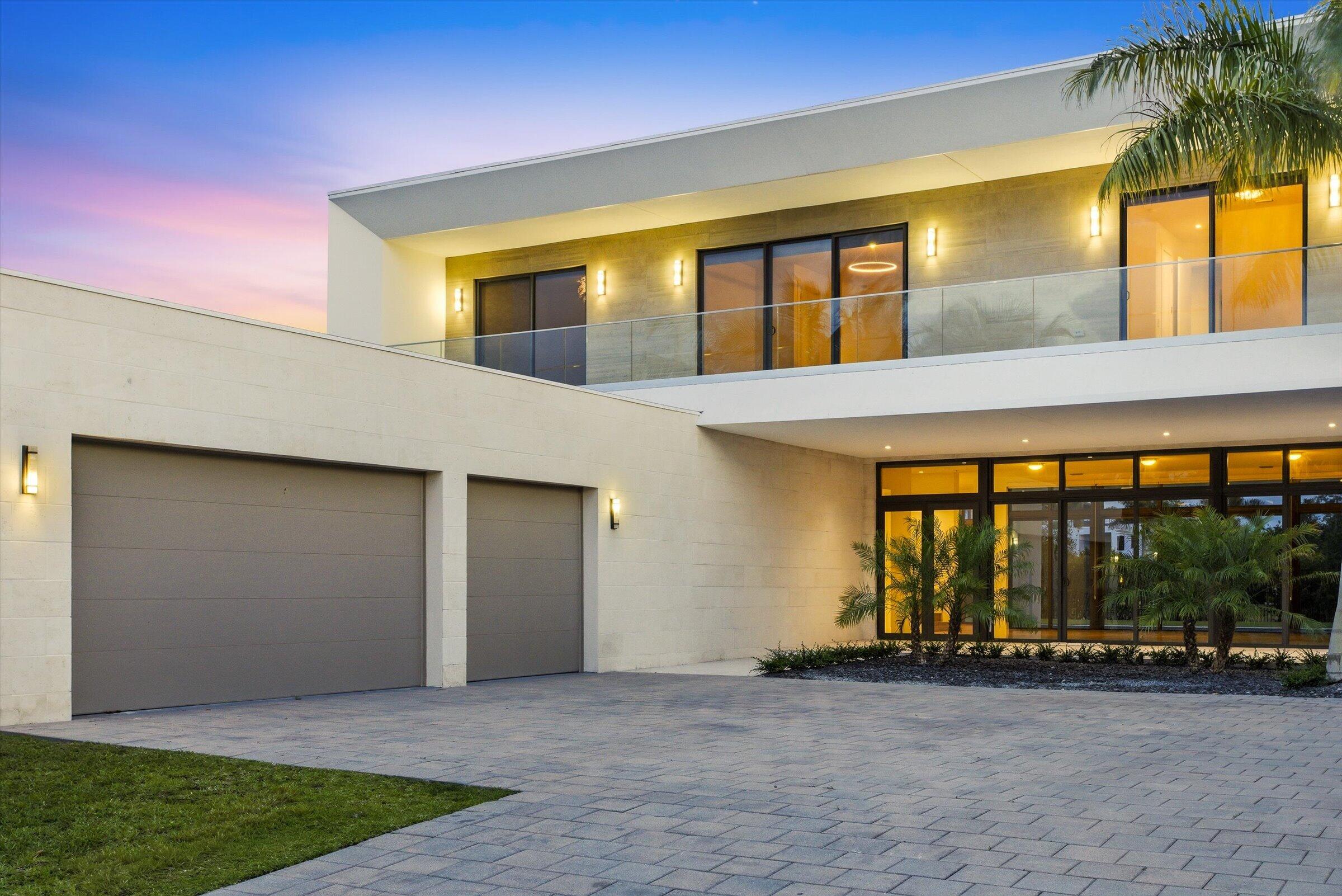 Spectacular lakefront residence in the exclusive Botaniko community in Weston—a private enclave of modern homes designed by renowned architects. This exceptional property features 5 bedrooms plus a dedicated office and 6.5 bathrooms. Interior highlights include porcelain tile flooring in the main living areas and hardwood floors throughout the bedrooms and staircase. The home offers an open-concept layout with a sleek Italian kitchen equipped with top-of-the-line appliances. Outdoor living is elevated with an oversized pool, expansive covered patio, and fully equipped summer kitchen—ideal for entertaining. Additional features include a wraparound balcony, oversized driveway, and a 3-car garage.