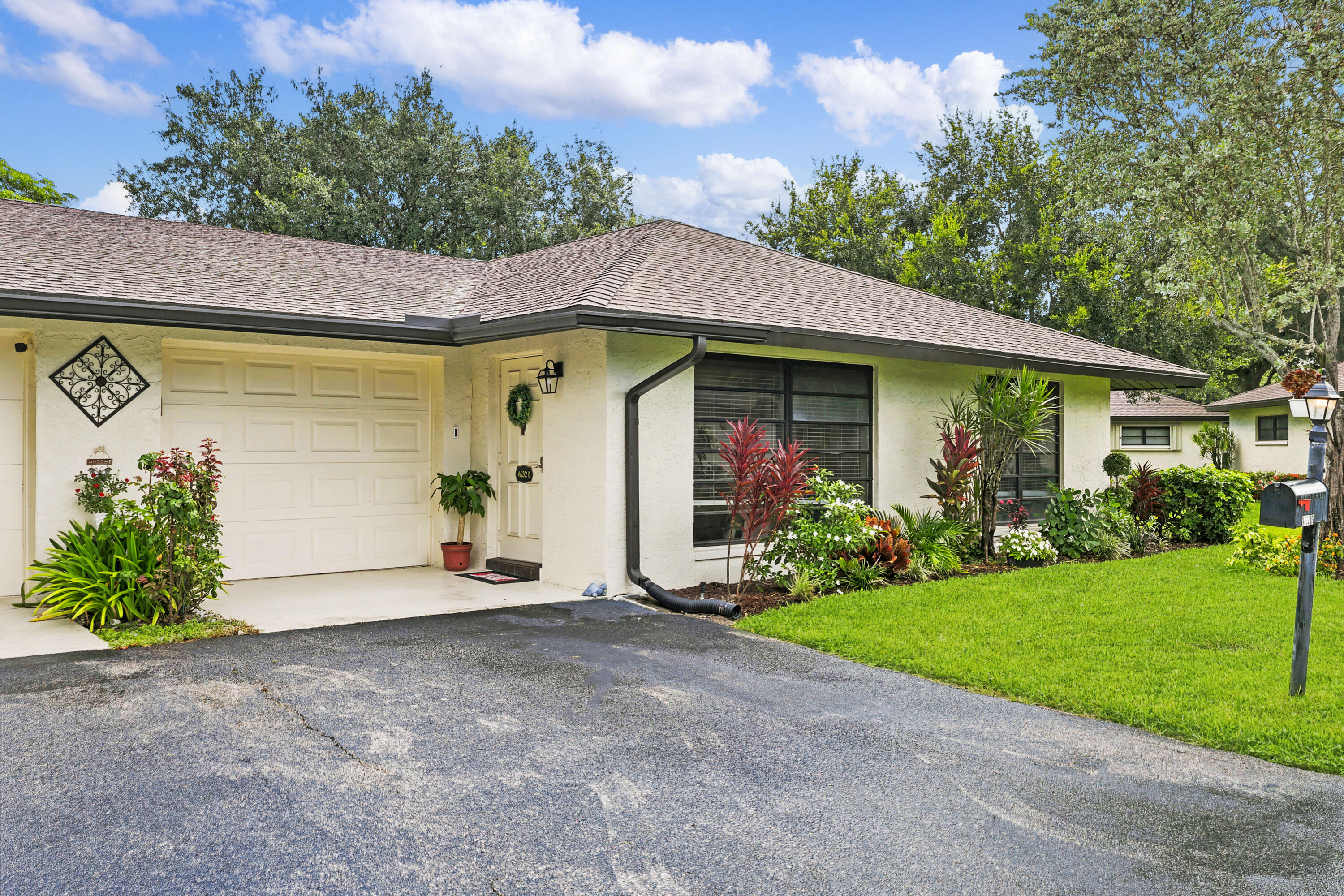 Welcome to this beautifully updated villa in the highly desirable 55+ community of Green Tree Villas in Boynton Beach. This move-in-ready residence offers the perfect blend of comfort, style, and low-maintenance living. Step inside to discover freshly painted living and dining areas, attractive wood flooring, and an updated kitchen featuring crisp white cabinetry and stainless-steel appliances. Major improvements provide peace of mind, including a brand-new roof that is fully paid for and currently in line to be installed, as well as a newer A/C system, helping ensure years of worry-free ownership. Enjoy the Florida lifestyle from your private paver patio, the perfect space for morning coffee, outdoor dining, grilling, or simply relaxing in the sunshine. Green Tree Villas offers exceptional value with HOA dues that cover roof maintenance, exterior insurance, cable, water, landscaping, common area maintenance, and trash service. Residents enjoy access to six community pools and clubhouses, creating endless opportunities for recreation, fitness, and social activities. Ideally located just minutes from shopping, restaurants, entertainment, medical facilities, and major roadways, this beautifully maintained villa presents an outstanding opportunity to enjoy carefree South Florida living in one of Boynton Beach's most sought-after active adult communities.