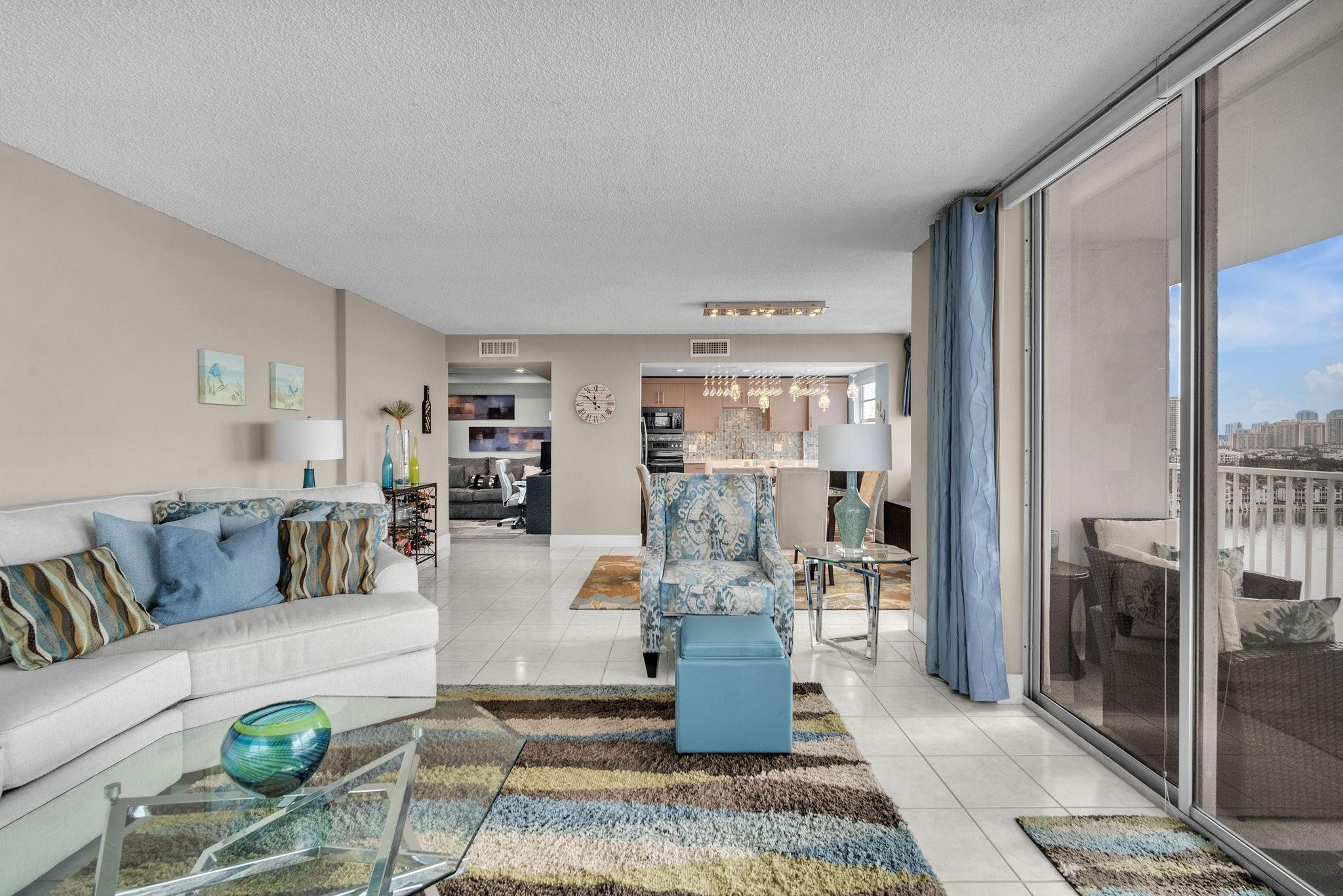 Amazing 2-bedroom, 2-bath plus den condominium in the heart of Aventura. Price reduced to $415,000 for immediate sale! Offered turnkey and can be purchased with furniture—just bring your toothbrush. Tastefully updated throughout with a completely renovated kitchen and baths featuring new cabinetry, appliances, glass tile backsplashes, quartz countertops, Jacuzzi tub, updated flooring, and modern lighting. New Bosch A/C with smartphone-controlled thermostat (2023). Enjoy panoramic bay and Intracoastal views from the wrap-around balcony—watch dolphins by day and stunning sunsets by night. Walk to shopping, dining, and parks.  Perfect views, perfect location! Seller will satisfy the outstanding special assessment at closing from seller proceeds, contingent upon acceptable sale price. Seller will satisfy the outstanding special assessment at closing from seller proceeds, contingent upon an acceptable sale price.