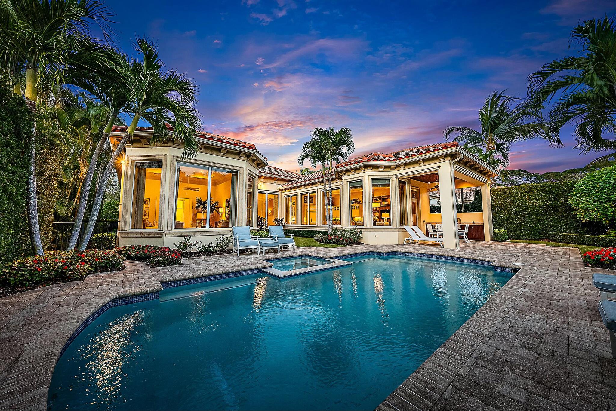 Welcome to the renowned Old Palm Golf Club! This elegantly furnished 4-bedroom former builder's model home seamlessly blends soft natural tones with refined contrasts, creating a sense of balance and sophistication throughout. Upon entry, you're welcomed by a bright, open layout illuminated with natural light, enhanced by the home's desirable southern exposure. The thoughtfully crafted split floor plan offers both functionality and flow, perfectly suited for comfortable living and stylish entertaining. This home has been meticulously maintained by its original owner, with minimal use, allowing it to show more like a new home. Old Palm Golf Club, one of Palm Beach County's most exclusive communities, boasts abundant amenities, including a state-of-the-art lifestyle center. The 18-hole Raymond Floyd signature course is playable and challenging for every level of golfer & the 27-Acre Practice Facility with 3 full length practice holes, offers a place to practice all facets of the game. Old Palm offers an unparalleled location among luxury club communities in northern Palm Beach County. Ideally positioned, it is just 15 minutes from Palm Beach, West Palm Beach, and Palm Beach International Airport to the south, 10 minutes north to Jupiter, and less than 25 minutes to Hobe Sound, an emerging hub for elite golf clubs.