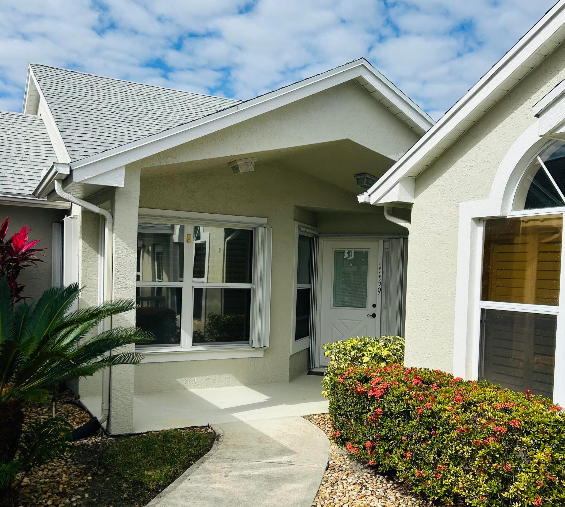 Cute and cozy villa set back in the courtyard walkway, with preserve view, located in Kings Isle of Saint Lucie West. This villa is one of the larger villas offered in Kings Isle. Open floor plan with split bedrooms, enclosed tile porch backs to preserve. Primary bedroom with dual sinks, ample closet space and shower. Eat-in kitchen with granite counters, stone backsplash, stainless steel appliances and quaint breakfast bar. Large utility room with shelving. Accordion shutters and plantation shutters. Kings Isle is an active 55+ community with 15,000 sq. ft. clubhouse, fitness center, arts & crafts, ballroom, billiards, library, pool, spa, tennis, bocce, shuffleboard, horseshoe pit and more. This unit comes with covered parking.