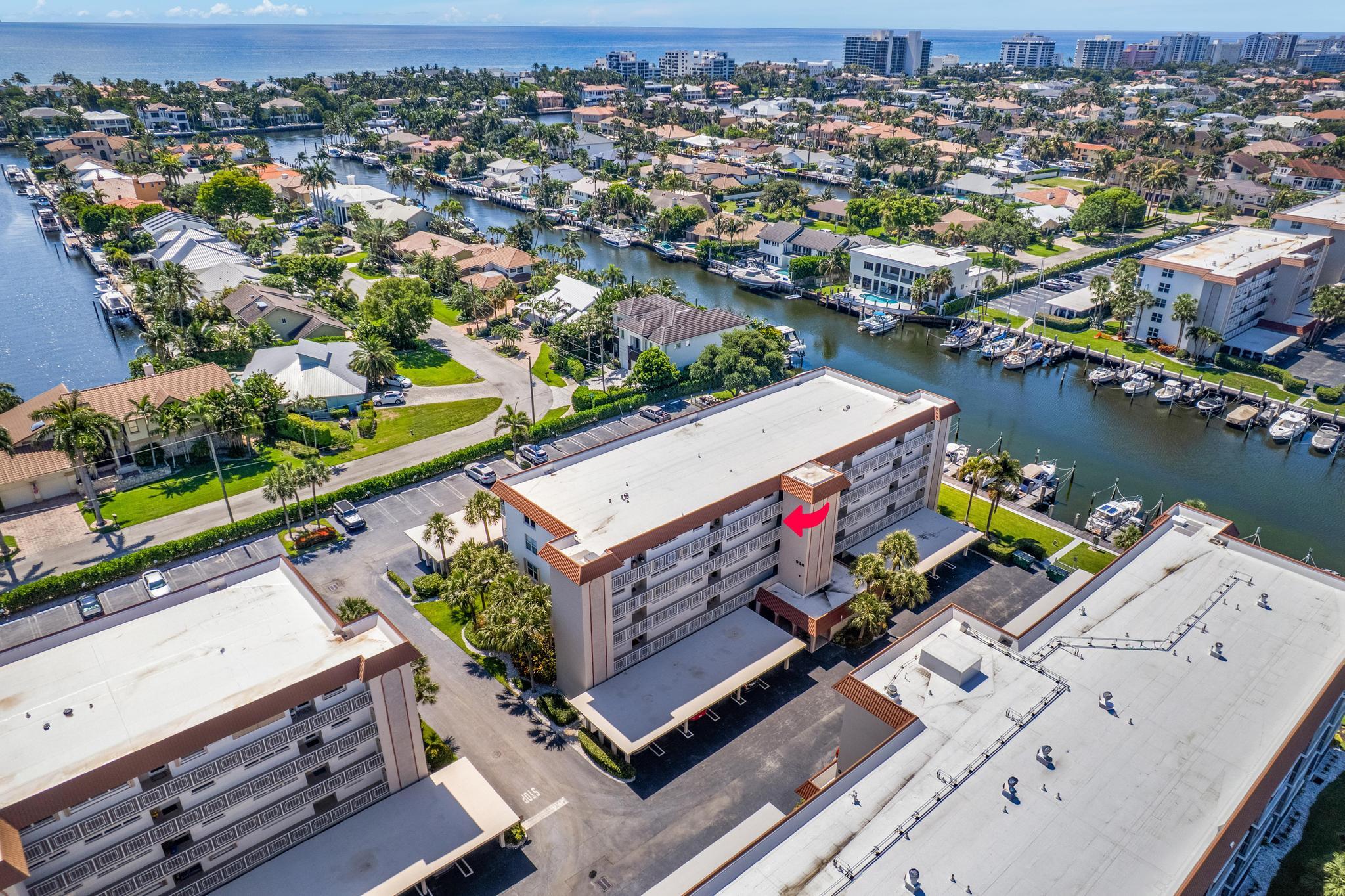 4th Floor Unit, Canal Views, IMPACT Glass and Sliders, 2026 AC, 2025 ROOF, updated electric panel, WASHER/DRYER Inside the unit (!).  Porcelain floors on diagonal throughout, opened up kitchen and patio, both baths updated w vanities,flooring,lights,fixtures, showers. Carport parking #24.  Many clubs & Social events within the community!! 3 heated pools, 2 clubhouses (weight/fitness area,community room and kitchen) & BOAT DOCKAGE for 20'-45' boats! Only $22/ft plus elec + water,for the year! ON SITE Mgmt! Assn fees: cable/internet/water for the unit. Shopping nearby & 1 mile to beach.