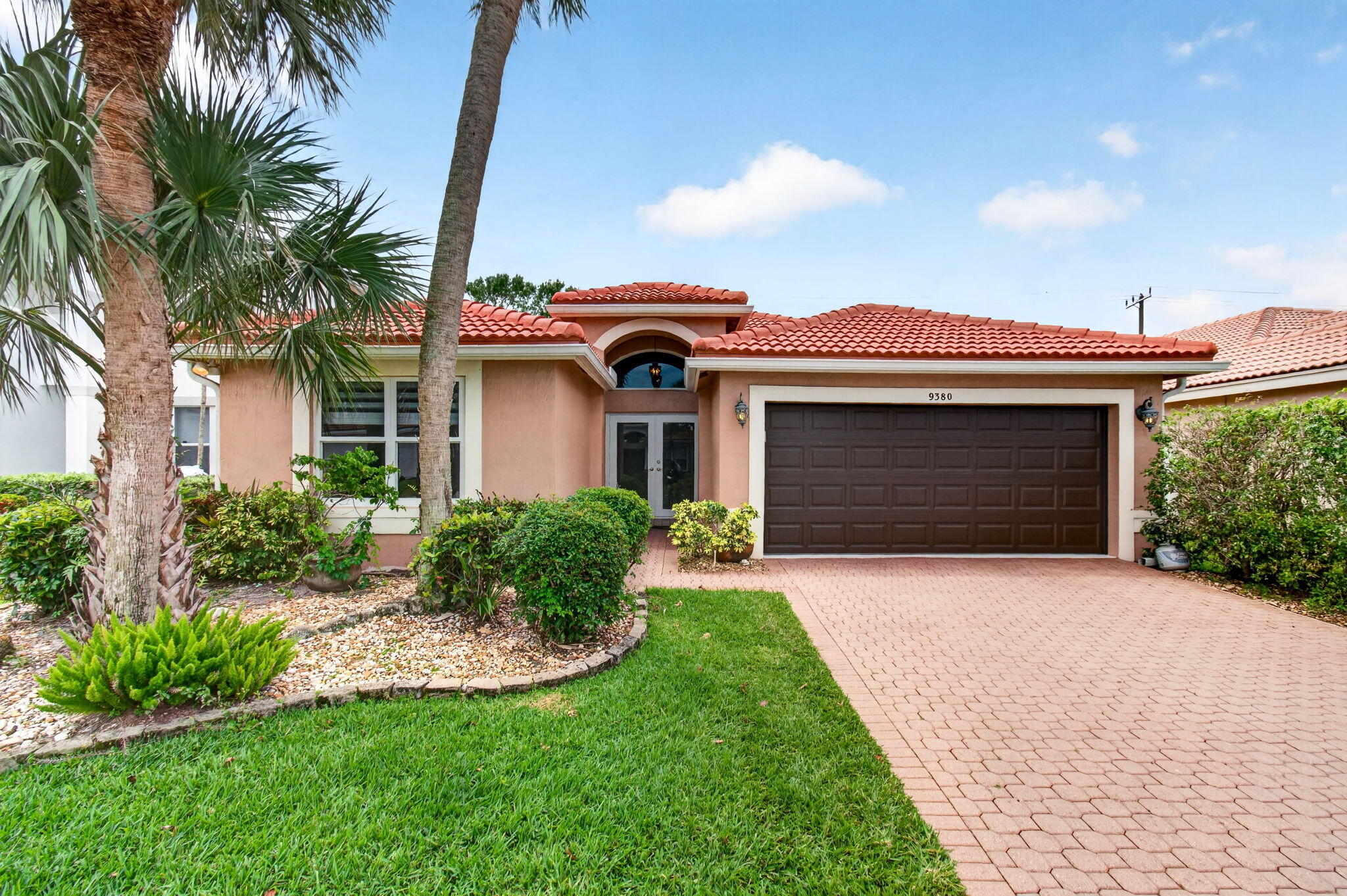Sparkling clean and barely lived in, this stunning single-story pool home is perfectly situated in a prime Boca Raton location within the sought-after Symphony Bay community!  Rarely does a home this immaculate hit the market.  Featuring soaring cathedral ceilings, a split floor plan, and a bright open layout, this 3-bedroom, 2 full bath residence is truly move-in ready—  Enjoy peace of mind with a newer roof (2021), A/C (2020), and complete impact windows  & doors (2022). The recently remodeled front bathroom showcases high-end Kohler finishes, while custom California Closets in two of the bedrooms provide stylish, built-in organization.  All interior and exterior floors have been professionally cleaned & sealed.  The garage has just been freshly painted with newly sealed floors,   highlighting the home's pristine condition.  Natural light pours in, creating a warm and inviting atmosphere.   You'll enjoy the private pool year round with the new, never used pool heater.    Symphony Bay offers residents exceptional amenities including a gorgeous clubhouse, heated community pool, newly designed playground, pickleball courts, gym, and more. Located in a highly desirable area with A-rated schools, convenient to restaurants, shopping, and the Turnpike.  This home is truly a gem—don't miss this exceptional opportunity in the heart of Boca Raton!