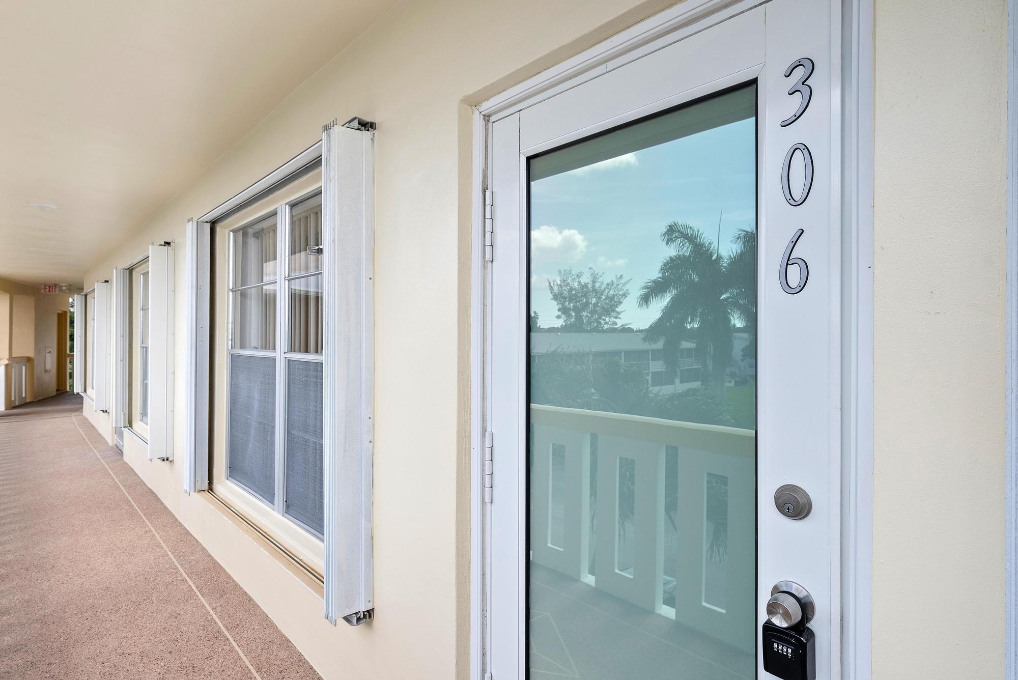Spacious 3rd-floor 2BR/2BA condo in Century Village's sought-after Wellington section (55+), featuring beautiful water views throughout. Large living room, dining area, and kitchen with island. Primary suite offers waterfront views, ensuite bath, and walk-in closet. Enclosed lanai, impact windows, neutral tile flooring, and extra storage. Pet-friendly building with elevator, trash chutes, and two resident pools.
