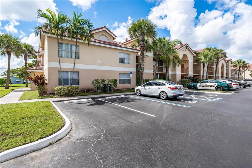 Spacious three bedroom condo in the heart of Tamarac! Open floor plan with vaulted ceilings. There is laminate flooring in living areas. Kitchen has wood cabinets and plenty of counter space. Ample sized living room with access to balcony. Dining room and snack bar option. Master suite has private balcony with relaxing lake views. Enormous walk in closet and updated bathroom. The two secondary bedrooms are split from master suite for privacy. Community has pool and tennis courts and lots of nicely landscaped and lake areas. This is a great opporunity for a first time buyer or an investor.