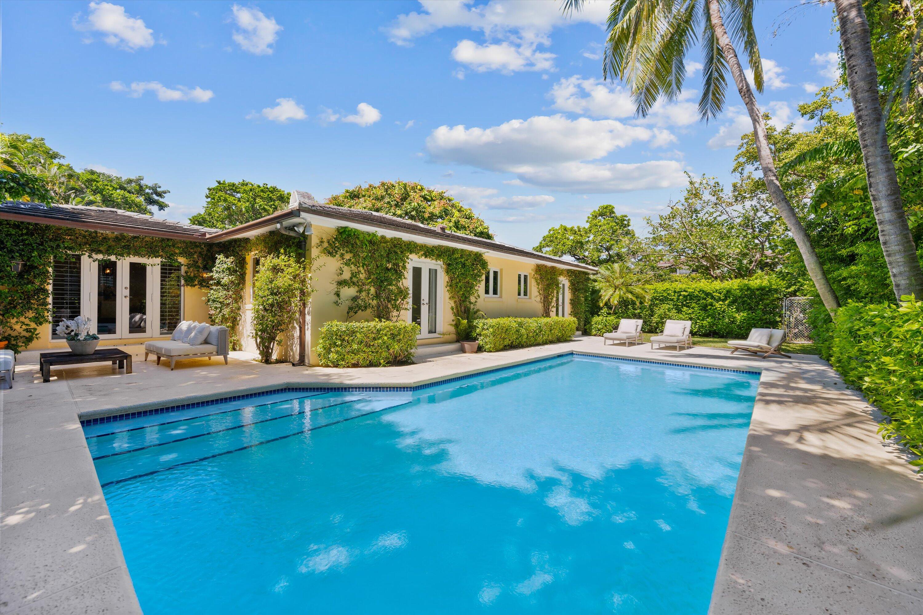 Highly sought after North End Bermuda style 3-BR, 3-BA home plus office situated on a 13,500 SqFt Lot. Lush tropical landscaping surrounding pool. Impact windows and doors, full house generator, 2-car air-conditioned garage. Versatile property with option to build new on this 13,500 SqFt Lot or simply maintain the North End Bermuda charm of the existing property. Monterey has lake trail and easy beach access nearby.  The information published and provided including but not limited to prices, measurements, square footages, lot sizes, features, finishes, and calculations are subject to errors, omissions or changes without notice. All such information should be independently verified. All parties should perform their own due diligence to verify all information.
