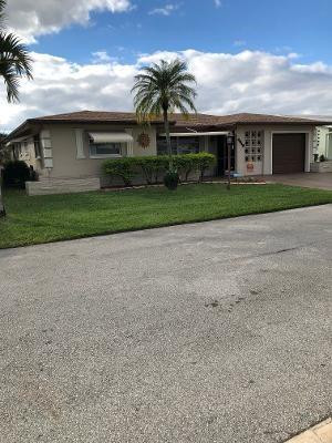 Lovely 2/2/1 in ALL AGE COMMUNITY ON CANAL.  Roof, hot water tank less then 2 years.  A/C 5 years old.  Newer kitchen with under cabinet lights garbage disposal and dishwasher.  Redone baths.  Jacuzzi tub in 2nd bath.  Master bath has shower.  Tile throughout house.  Living room has laminated  wood floor.  Crown molding in family, living room and dining room.  French door leading into the master bed room, walk in closet in master bed room.   2 ceiling fans in  house and 2 in garage.Close to all highways, stores, bus line and Churches.Maintenance includes  lawn and pool.  Pool is heatedFences are allowed and must be approved by association  Must be chain linked and 4 ft high onlyNo showing after 6 PM.