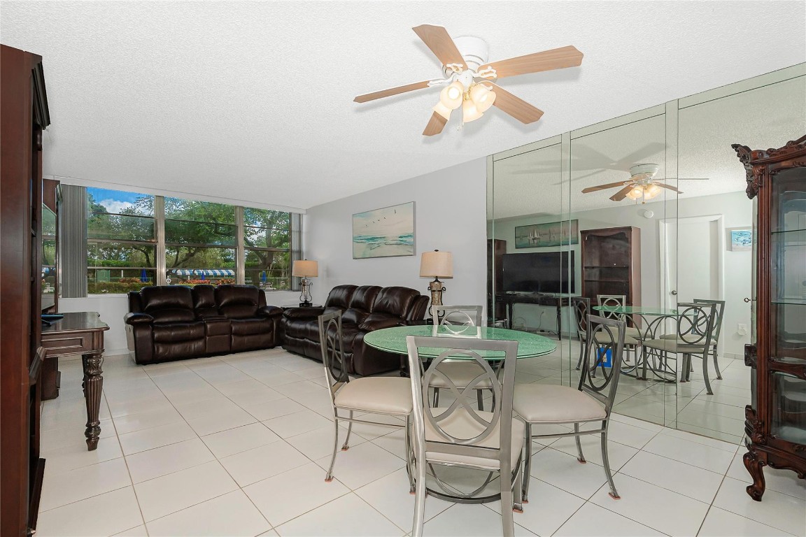 You will not find a better apt. in all of Pembroke Pines ! Great 1st floor location close to the pool and clubhouse. Bathrooms and kitchen have been updated, spacious closets have built-ins, no carpet or wallpaper, nice furniture available if you want it and it is in move-in condition!!!  Park Place is a 55+ development that has the best value for your money in Pembroke Pines. This outstanding community has every convenience only minutes away. Within the Guard Gated secure community you will enjoy an active lifestyle that includes tennis , pickleball, jogging paths , billiards, 4 heated pools, new park with a barbecue to enjoy the outdoors, active clubhouse  and much more  Only 6 buildings. Park Place requires a minimum of 20% down a 700 credit score. Great time to buy, don't miss out!!!!