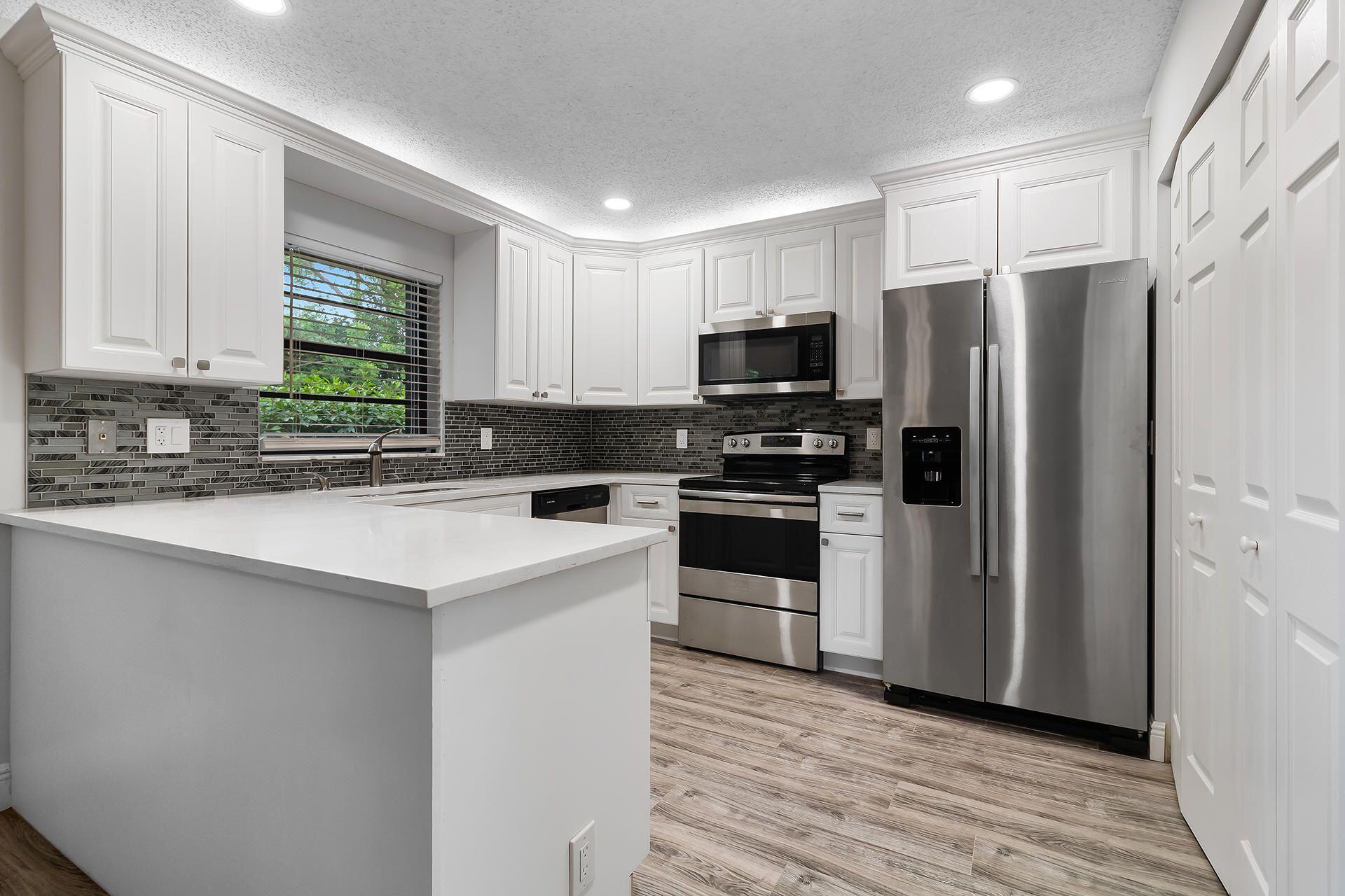 Welcome to this thoughtfully designed villa in Tradewinds at Dos Lagos Condo in Boynton Beach, Florida. This single-story residence offers 1,187 square feet of finished living space, featuring three bedrooms and two full bathrooms that provide comfortable accommodation for various living arrangements. The efficient floor plan makes excellent use of the available space, creating a practical layout suited for everyday living. Located within the Tradewinds at Dos Lagos community, this villa presents a convenient residential option in Boynton Beach. Discover the potential this property holds for your next chapter.