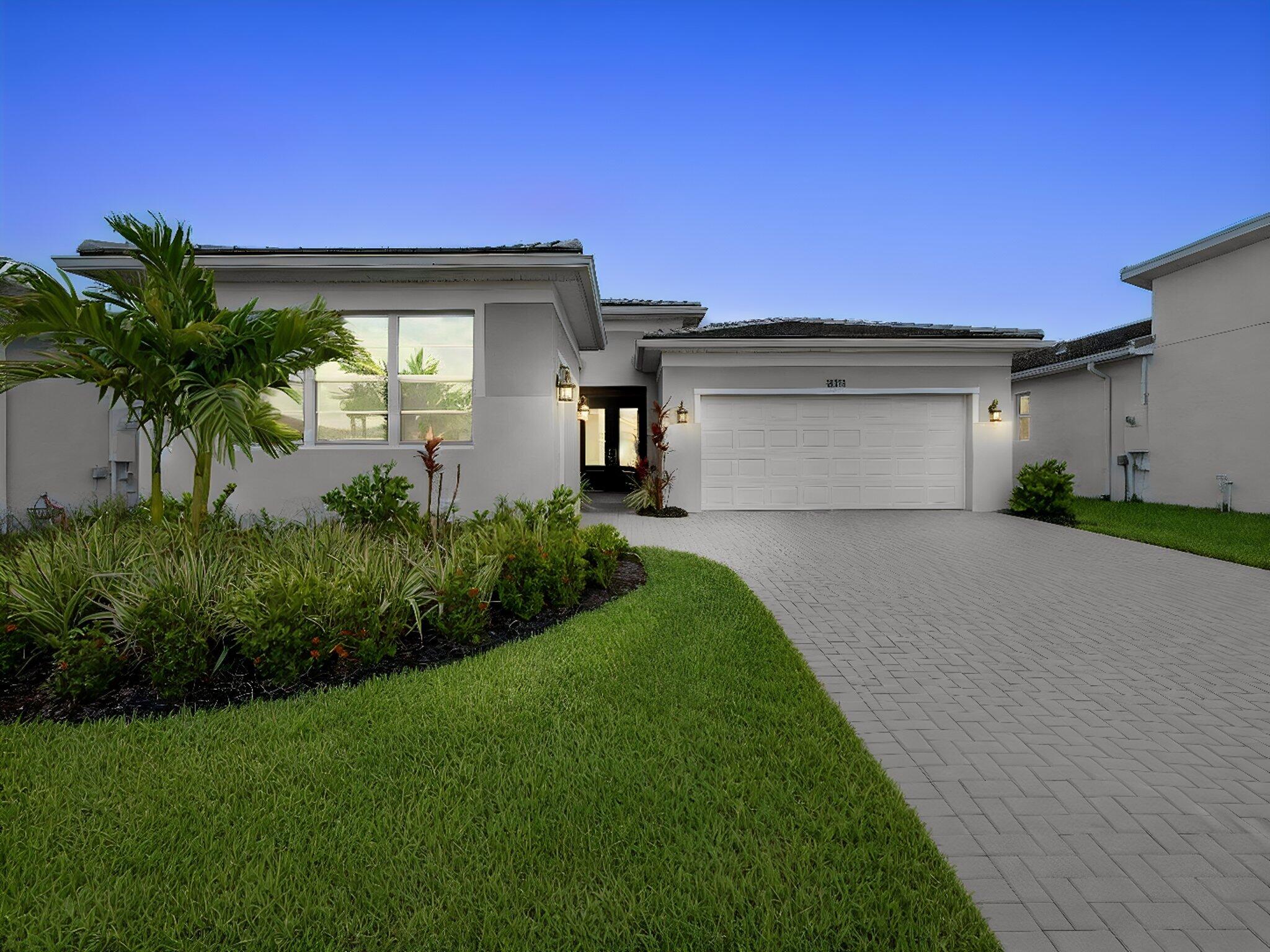 Experience refined living in this beautifully appointed Sage Elite floorplan, located within the exclusive Tranquility Collection at Telaro. This 3-bedroom residence with a versatile flex room (ideal for an office, den, or optional fourth bedroom), 2.5 baths, and a spacious 3-car garage offers 2,210 square feet of thoughtfully designed living space. Elegant, open-concept interiors flow seamlessly to a covered and screened lanai—perfect for relaxing or entertaining. The expansive owner's suite serves as a private retreat, featuring a spa-inspired bath and oversized walk-in closet. Additional highlights include ceiling fans throughout, a gas range and dryer, a generous laundry room, and a large pantry. Located within the vibrant and amenity-rich Telaro at Tradition community, residents enjoy access to resort-style pools, a state-of-the-art fitness center, on-site dining, tennis, pickleball, bocce, scenic walking trails, and more. The HOA fee enhances the lifestyle by including cable, high-speed internet, alarm monitoring, landline phone service, and access to resort-style recreational facilities, delivering exceptional value and convenience. With golf cart-friendly access to nearby shops and restaurants, this is effortless Florida living at its finest. Telaro is a 55+ community that has not yet reached its occupancy threshold, currently allowing buyers of all ages—making this an exceptional opportunity to secure your place in one of Tradition's most exciting lifestyle communities.