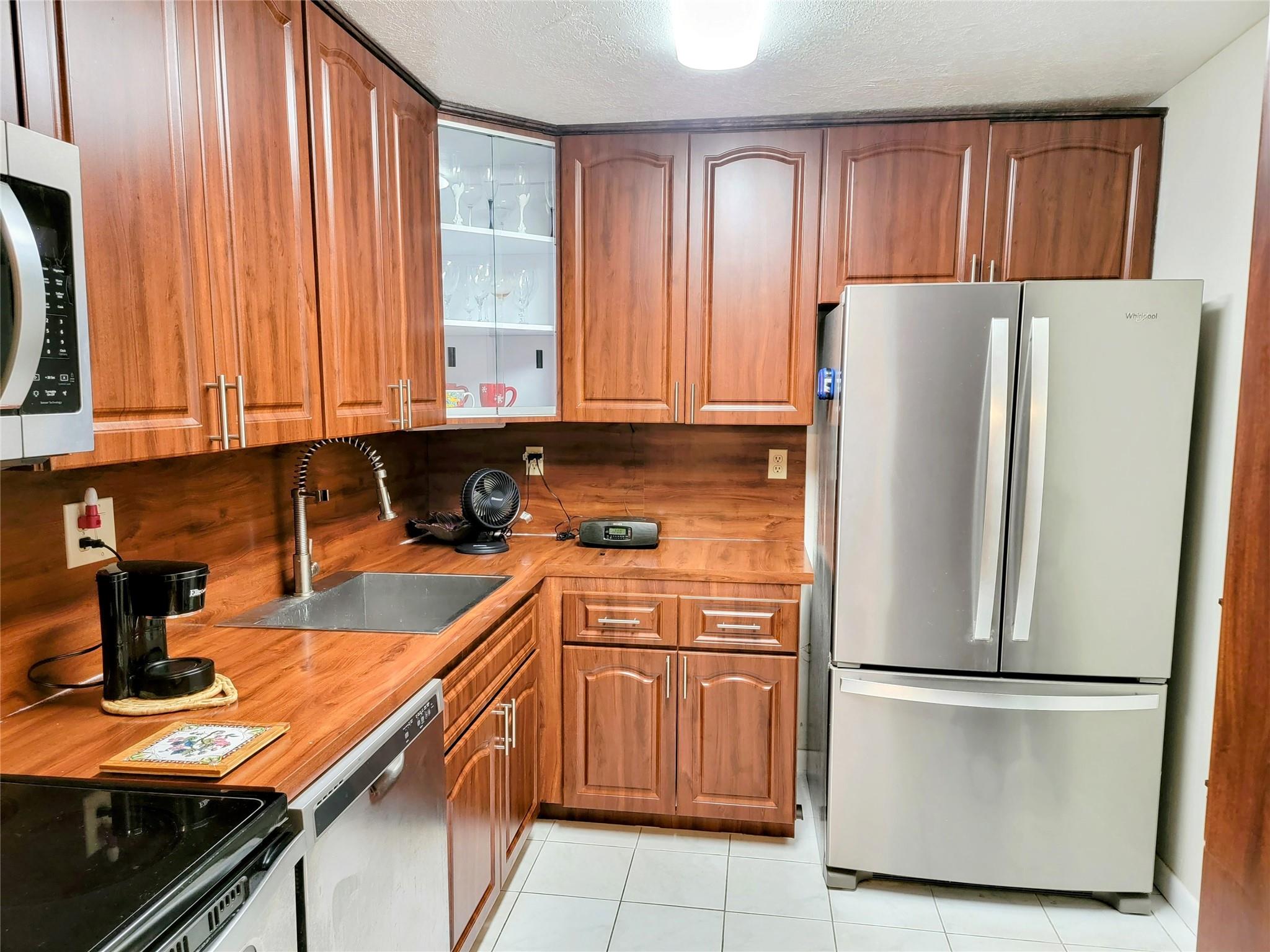 Lovely 2/2 Condo in a senior 55+ community. First floor corner unit. Tiles through out. Freshly painted. New 2023 Air- Condition. Stainless Steel Appliances. Walk-in closet. Porch with Hurricane shutters. Extra storage. Bright and spacious. Heated pool,Tennis court, Clubhouse with Gym and Library. Monthly fee includes water, high speed internet, cable, insurance, pest control. Short walk to pool. Move-In Ready. Centrally located. Lobby secured building. No pets allowed. No rentals are allowed.