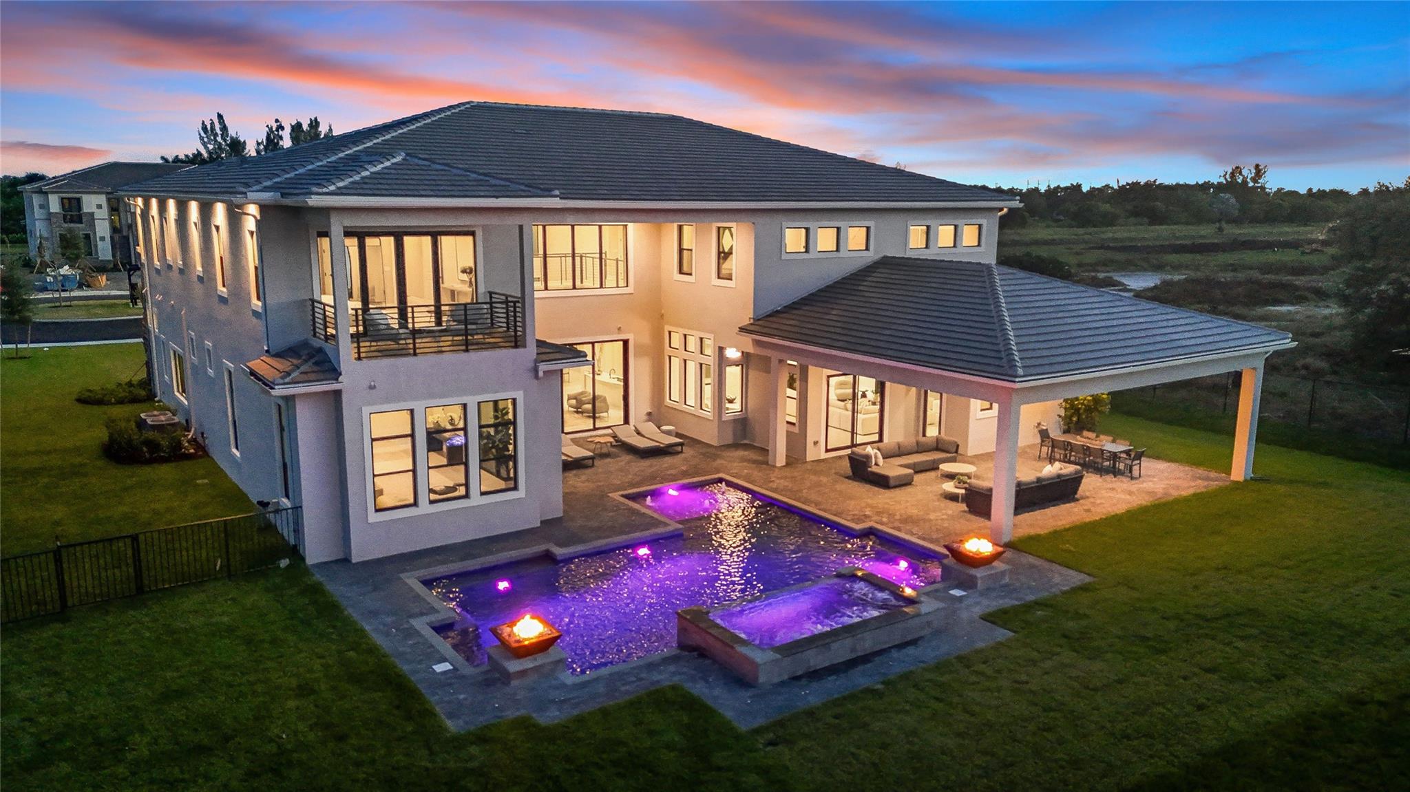 Spectacular brand new estate built on the best lot in the gated enclave of Millstone Ranches. Sprawling over 10,000 sq ft, the Villa Divina model features 6 bedrooms, 7.5 baths, an office, a dedicated theater room, a 4 car garage with a glass feature to admire your car collection and so much more. Walk into your 2 story living room with soaring ceilings and enjoy your morning coffee by the fireplace over looking your resort style pool. This kitchen is perfect for the lovers of hosting with a gigantic oversized island, wine cooler, top of the line professional appliances, gas stove and built in coffee/espresso maker. The master wing of the house features his-and-hers walk in closets, a massive master bathroom, and an office/seating area. Upstairs you are welcomed by an oversized loft that can be used as a second entertainment area, a game room, a gym and so much more. You will also find a junior suite and 3 additional guest rooms all with en-suite bathrooms. Millstone Ranches by Toll Brothers consists of only 18 luxury homes and is located in an excellent area of Davie, A+ schools, near shopping, main roads, parks, equestrian facilities and tons more!