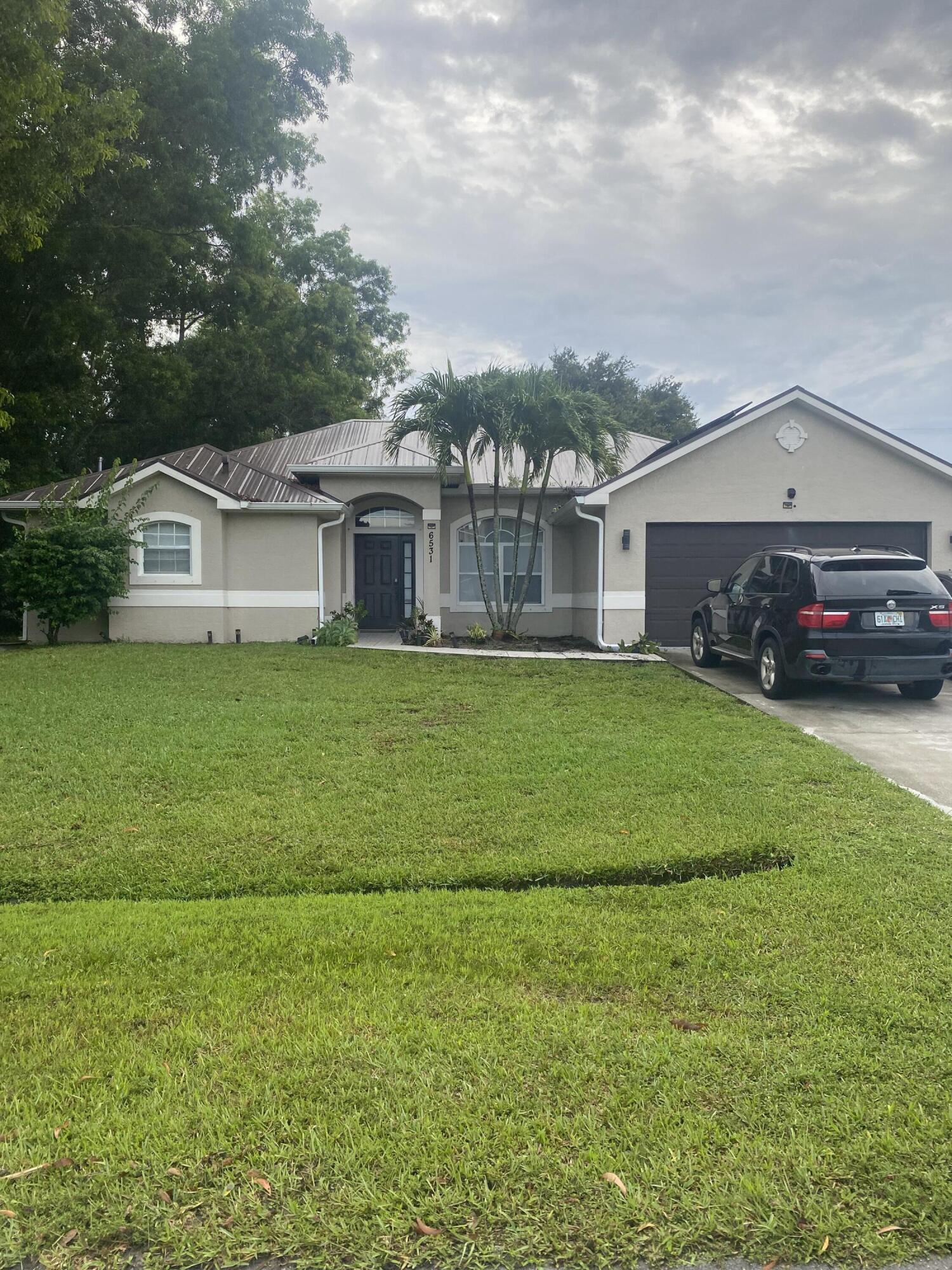 Prime Location! Look no further! Priced to sell! Welcome to this beautifully maintained 4-bedroom, 3 full bath, with a den/office and 2-car garage single-family home offering 2,055 sf under air. Featuring a master bedroom with 2 walk-in closets, newer metal roof installed in 2023, Water Heater 2025. Solar Panel to be assumed by buyers. This home combines long-term savings with peace of mind. Inside, you'll find a thoughtful layout perfect for families or multi-generational living. Step outside and enjoy the home's proximity to a local park, just steps away, featuring a tot lot and full basketball court. ideal for active lifestyles and family fun. Don't miss the chance to own this energy-efficient, move-in-ready home in a desirable location!