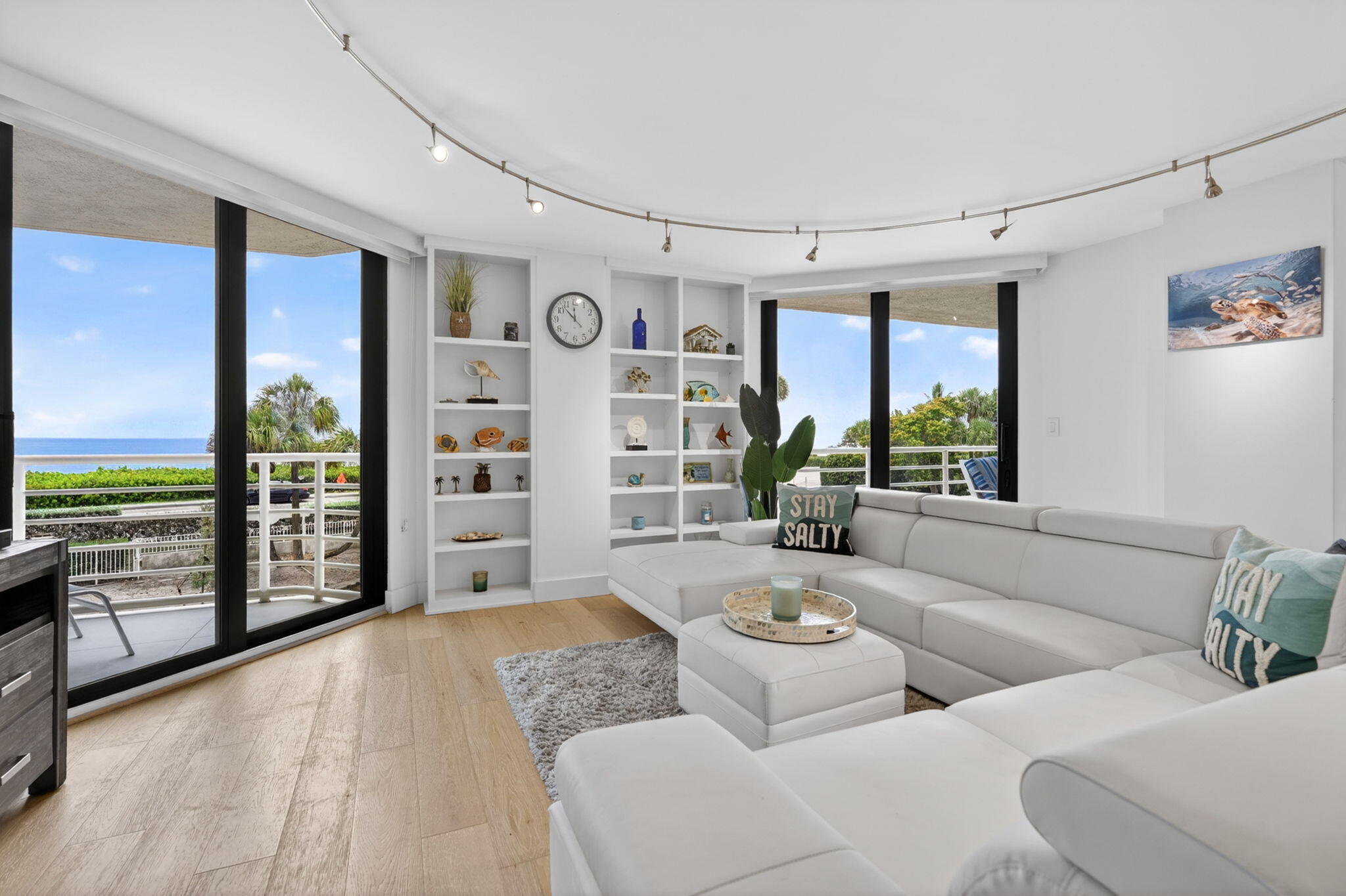 This beautifully updated 3 BR, 2.5 BA corner unit offers approximately 1,900 SF  with lovely ocean views!  This open-concept layout condo features luxury vinyl plank flooring throughout, HUGE quartz kitchen island, stainless steel appliances, spacious split bedroom floor plan, water views from every bedroom, garage parking, fully furnished with upscale furnishings including luxurious white leather sectional in the living area. An incredible value-add for buyers, as the owner paid approx 180k in assessments allowing the next owner to enjoy benefits of the community's extensive improvements. The bldg is currently completing installation of a new resort-style pool, making this an exceptional time to purchase in The Corinthians.  Ideally located near premier dining & shopping.  A GEM!