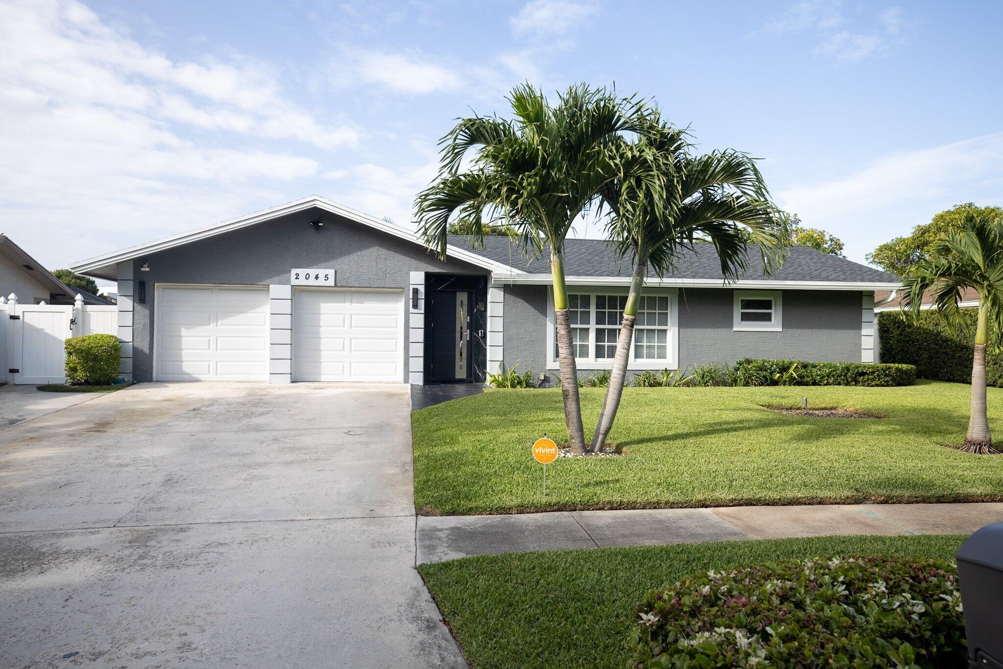 Welcome to Echo Lake Park - Your Private Oasis Awaits Tucked away in the highly desirable, tree-lined Echo Lake Park neighborhood, this fully renovated 4-bedroom, 2-bathroom pool home is a rare find — offering the perfect blend of style, comfort, and move-in-ready convenience, with no HOA. Step inside to an upgraded kitchen featuring granite countertops and stainless steel appliances, complemented by new 2022 flooring, central A/C (2022), and fresh interior and exterior paint. Designed with entertaining in mind, the open layout includes a spacious living room, family room, and formal dining room, all accented by elegant crown molding throughout. The two-car garage has been partially converted into a media room with a fully updated bathroom — ideal for movie nights, a home gym, or guest sui Welcome to Echo Lake Park - Your Private Oasis Awaits. Tucked away in the highly desirable, tree-lined Echo Lake Park neighborhood, this fully renovated 4-bedroom, 2-bathroom pool home is a rare find — offering the perfect blend of style, comfort, and move-in-ready convenience, with no HOA. Step inside to an upgraded kitchen featuring granite countertops and stainless steel appliances, complemented by new 2022 flooring, central A/C (2022), and fresh interior and exterior paint. Designed with entertaining in mind, the open layout includes a spacious living room, family room, and formal dining room, all accented by elegant crown molding throughout. The two-car garage has been partially converted into a media room with a fully updated bathroom — ideal for movie nights, a home gym, or guest suite.  The primary suite offers a generous walk-in closet, while impact windows, doors, and garage door provide peace of mind, along with a custom Doma Deco front door for standout curb appeal. Major updates are already done for you: a 2023 roof, 2024 tankless water heater, updated electrical wiring and panel (within the last 4 years), and a 2024 PVC vinyl fence surrounding your private backyard retreat — complete with a large patio, perfect for relaxing or hosting friends and guest. Location doesn't get better than this: minutes from I-95, Palm Beach International Airport, and the Palm Beach Outlets, with easy access to top dining, entertainment, parks, and pristine beaches. Sports fans will love being close to the Washington Nationals' Spring Training facility, and will appreciate the nearby, prestigious Bak School of Performing Arts. This home has it all — don't wait to make it yours. Schedule your private showing today before this Echo Lake Park gem is gone!