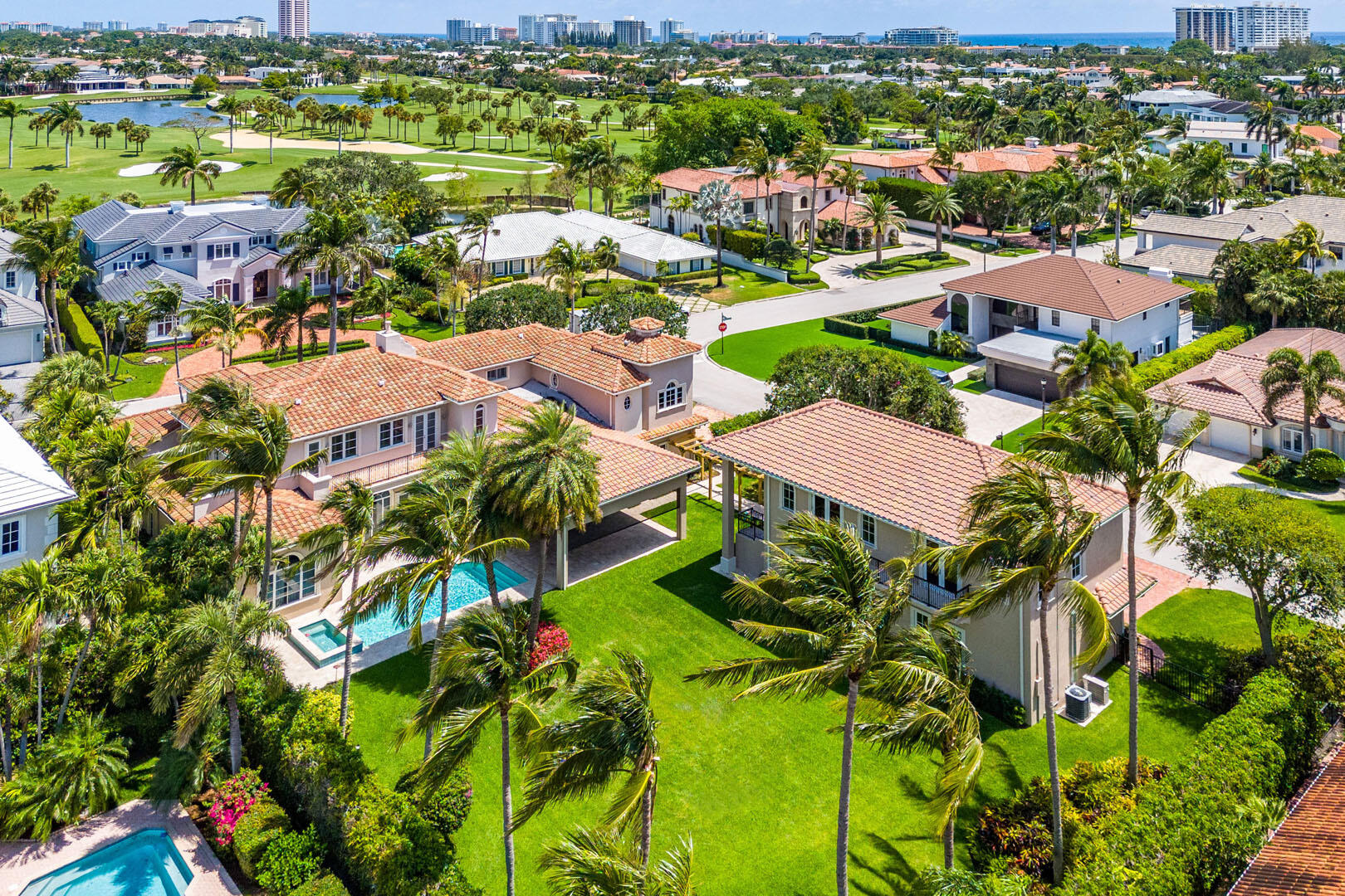 Discover luxury and privacy in this exquisite estate, set on a rare double corner lot in the heart of Royal Palm Yacht & Country Club. With over 7,000 square feet of living space, including a separate guest house, this six-bedroom, 7 full and 3 half-bathroom residence offers a harmonious blend of grand design and thoughtful amenities, making it a true assemblage for refined living.
 
The first-floor owner's retreat is a sanctuary of comfort, featuring a recently renovated bathroom and expansive walk-in closets. Culinary excellence is at the heart of the home, with a chef's kitchen that boasts top-of-the-line appliances, custom cabinetry, and dual islands ideal for casual gatherings and formal entertaining.
 
Step outside to your private resort-inspired backyard, where a new pool and spa take center stage amid lush surroundings. A covered terrace with retractable screens and a built-in BBQ offers the ultimate outdoor living and dining setting. Across a breezeway, a separate guest house awaits, providing an elegant and private retreat for visitors or extended family.
 
Additional highlights include a spacious six-car garage and a design emphasizing scale and intimacy. This exceptional residence offers unparalleled space, privacy, and timeless luxury, creating the perfect backdrop for your next chapter.
 
Royal Palm Yacht & Country Club features underground utilities, including natural gas, and 24/7 security. The exclusive community has a desirable location near beaches, fine dining and shopping, and the Boca Raton Resort & Beach Club.